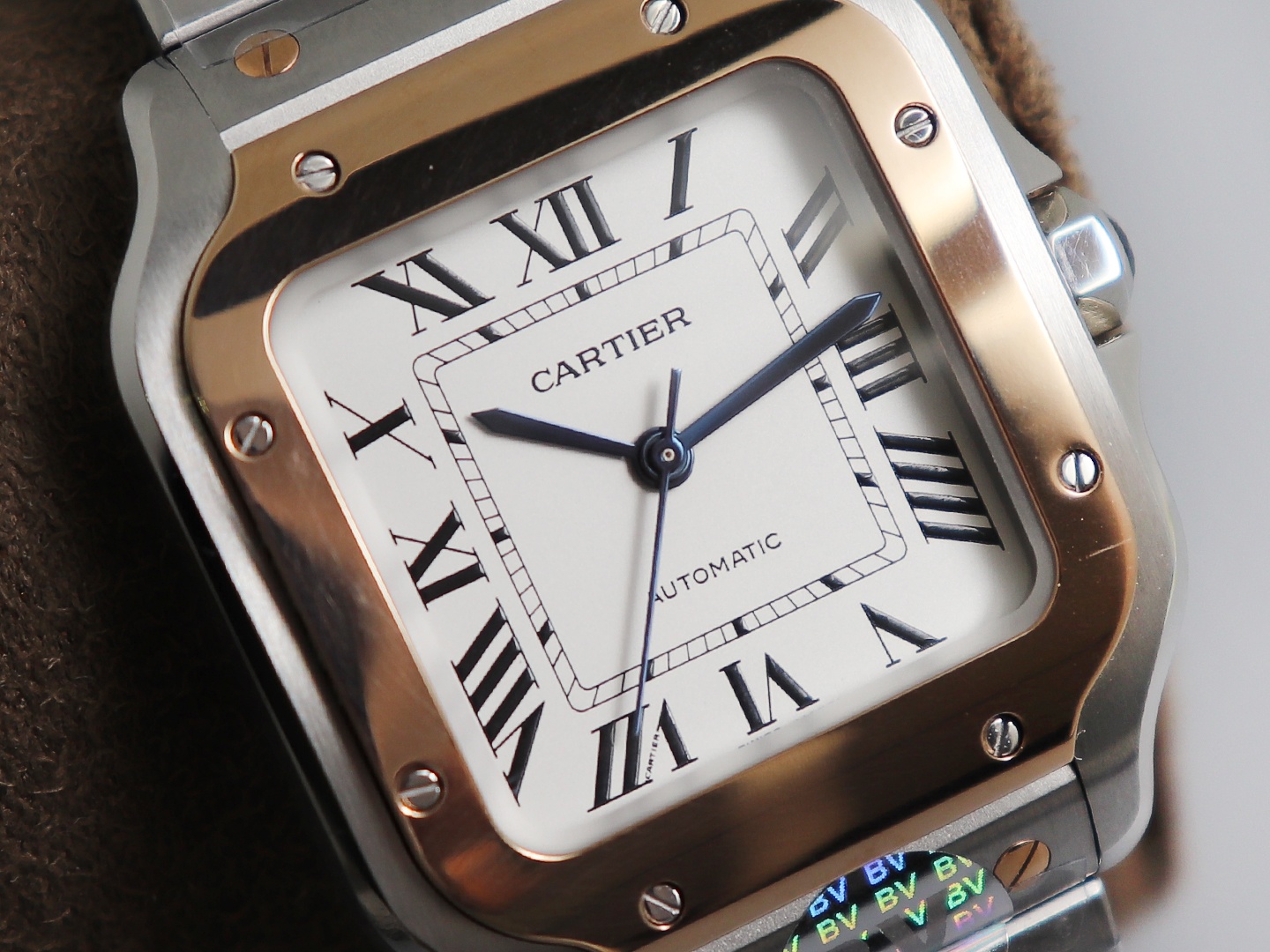 Ladies' Medium - Cartier New Santos Case: 316L stainless steel Dial: Gradient blue Hands: Swiss-crafted burnt steel blue Glass: Swiss anti-reflective coating/anti-scratch/anti-fingerprint AF treatment Strap: Features ergonomic SmartLink detachment system.