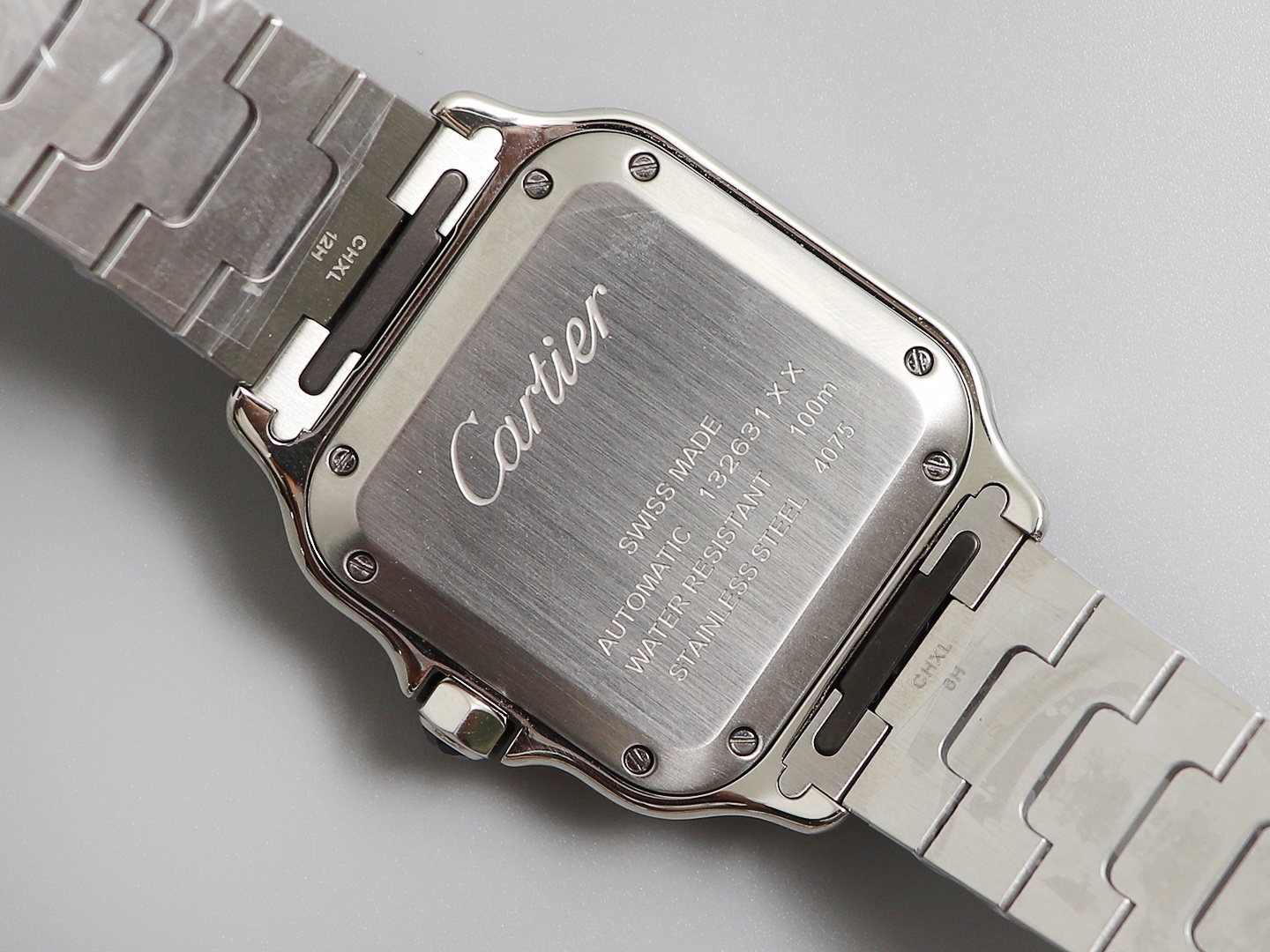 Ladies' Medium - Cartier New Santos Case: 316L stainless steel Dial: Gradient blue Hands: Swiss-crafted burnt steel blue Glass: Swiss anti-reflective coating/anti-scratch/anti-fingerprint AF treatment Strap: Features ergonomic SmartLink detachment system.