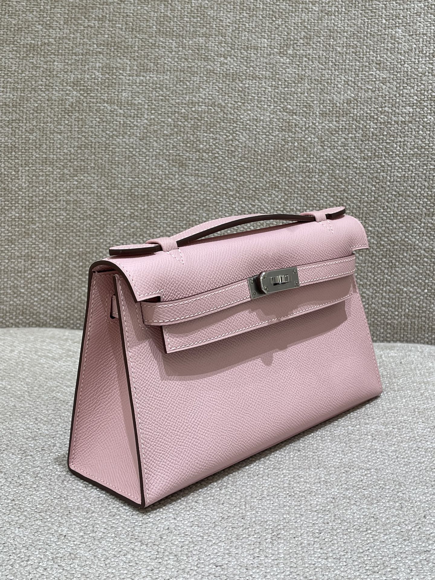 Hermès Model: Kelly Mini First Generation Color: 3Q Cherry Blossom Pink with Silver Buckle Dimensions: 22cm x 14cm x 7cm