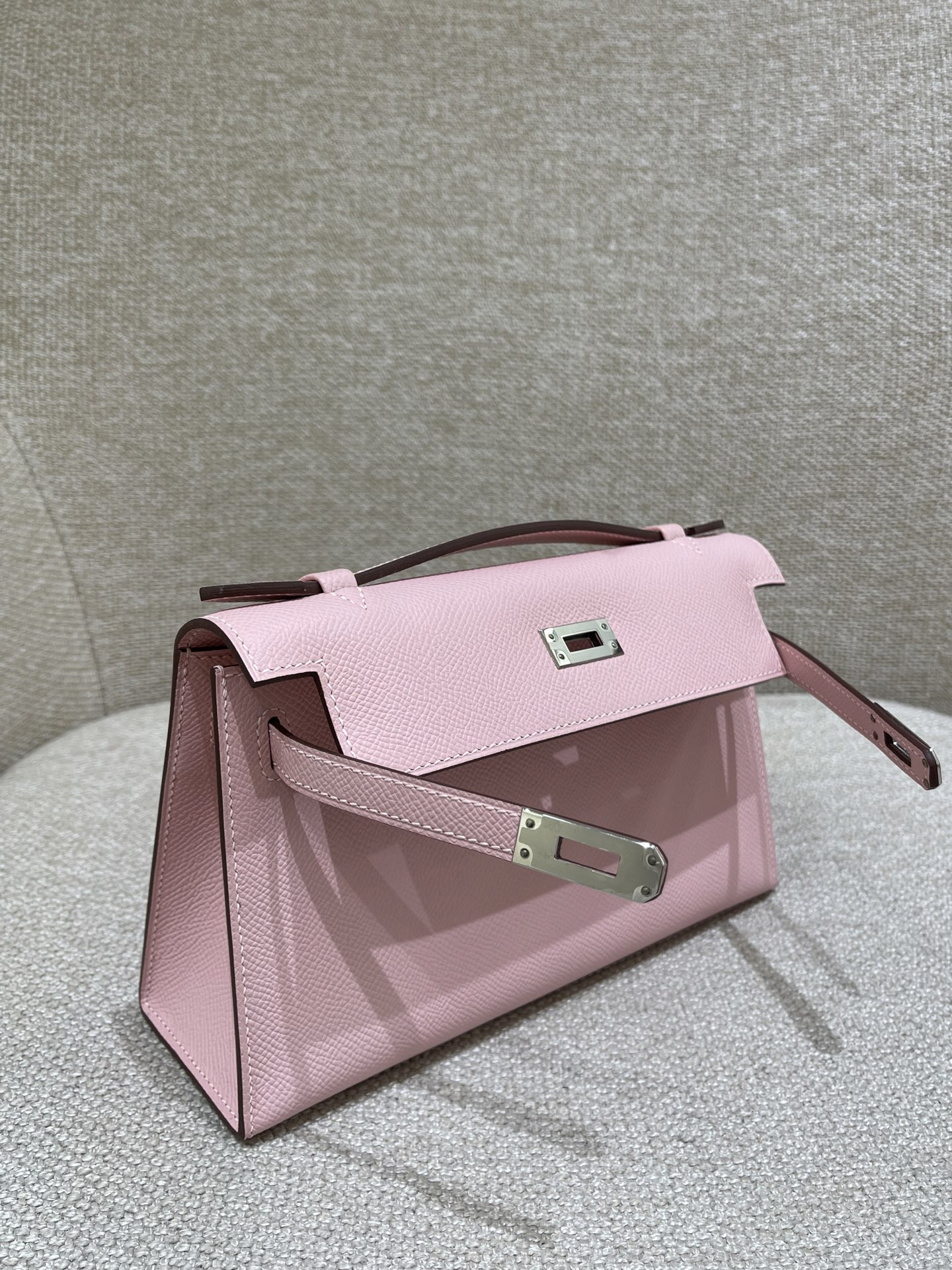 Hermès Model: Kelly Mini First Generation Color: 3Q Cherry Blossom Pink with Silver Buckle Dimensions: 22cm x 14cm x 7cm