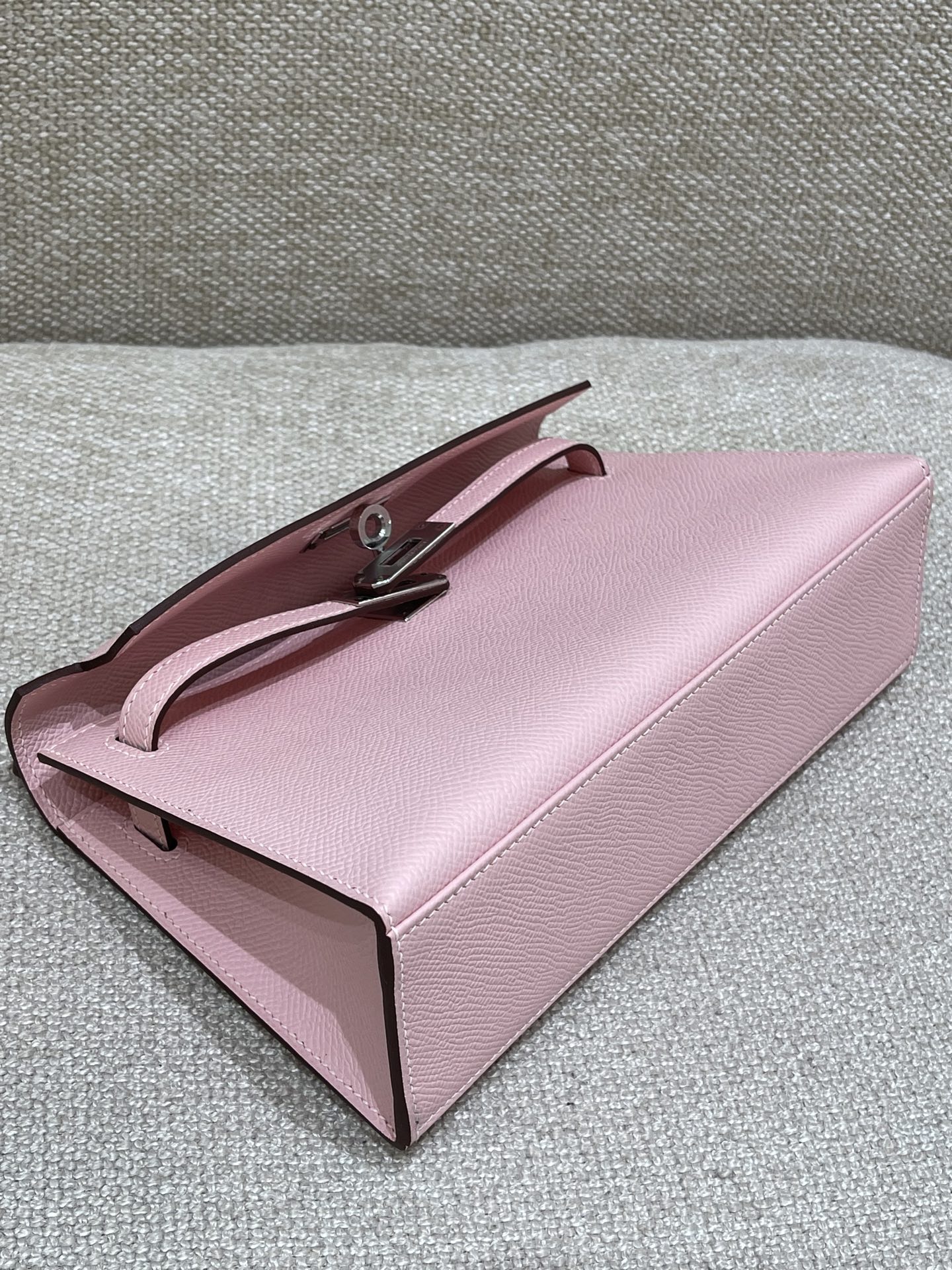 Hermès Model: Kelly Mini First Generation Color: 3Q Cherry Blossom Pink with Silver Buckle Dimensions: 22cm x 14cm x 7cm