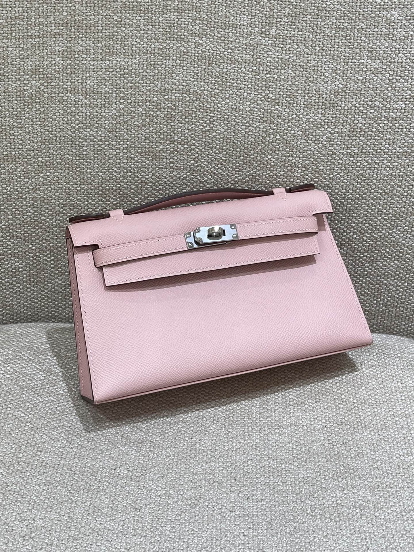 Hermès Model: Kelly Mini First Generation Color: 3Q Cherry Blossom Pink with Silver Buckle Dimensions: 22cm x 14cm x 7cm