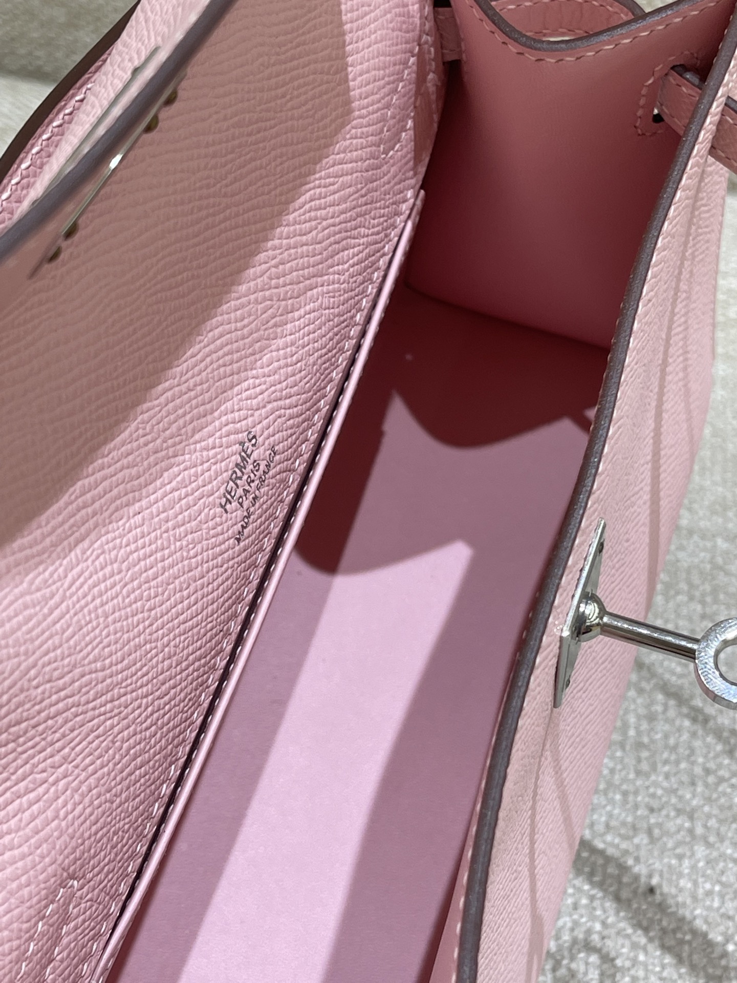 Hermès Model: Kelly Mini First Generation Color: 3Q Cherry Blossom Pink with Silver Buckle Dimensions: 22cm x 14cm x 7cm