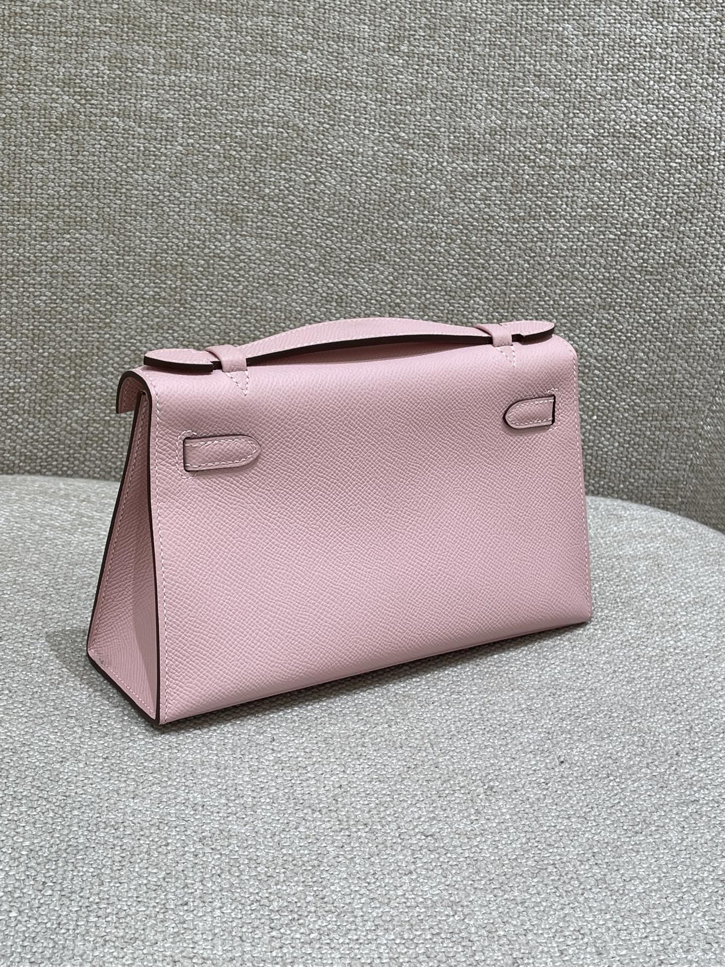 Hermès Model: Kelly Mini First Generation Color: 3Q Cherry Blossom Pink with Silver Buckle Dimensions: 22cm x 14cm x 7cm