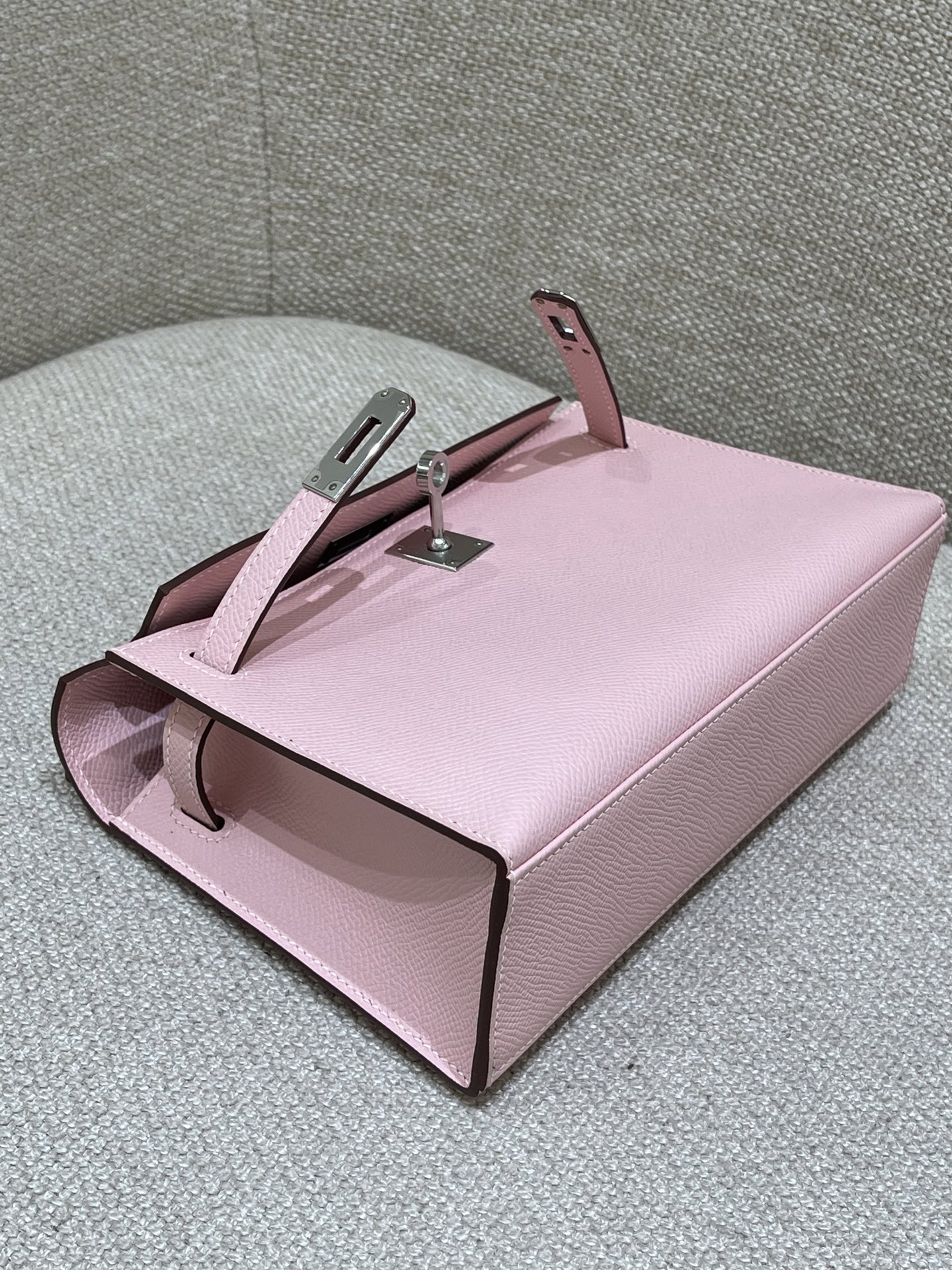 Hermès Model: Kelly Mini First Generation Color: 3Q Cherry Blossom Pink with Silver Buckle Dimensions: 22cm x 14cm x 7cm