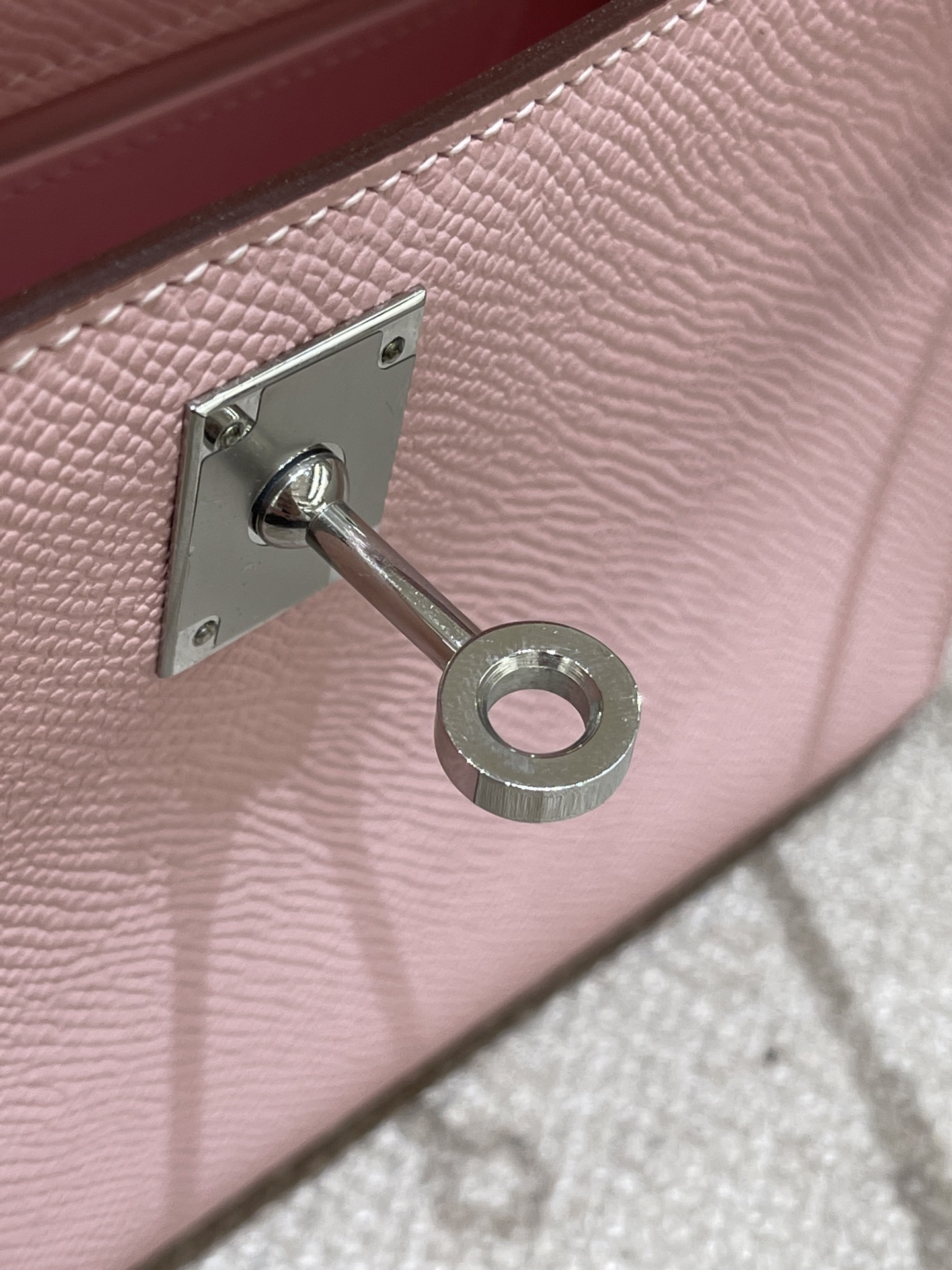 Hermès Model: Kelly Mini First Generation Color: 3Q Cherry Blossom Pink with Silver Buckle Dimensions: 22cm x 14cm x 7cm