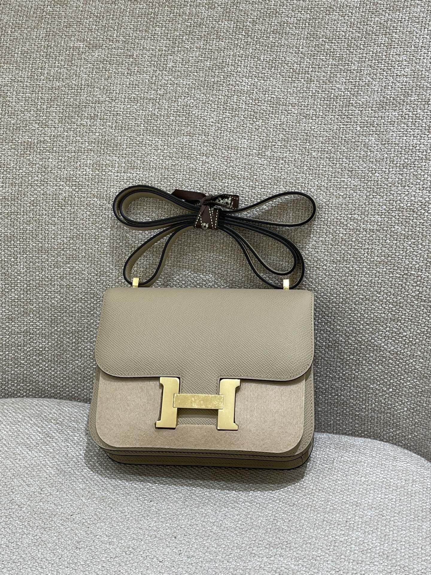 Hermès Model: Constance 19 Color: Trench Gray with Gold Hardware Dimensions: 19cm x 15cm x 4cm