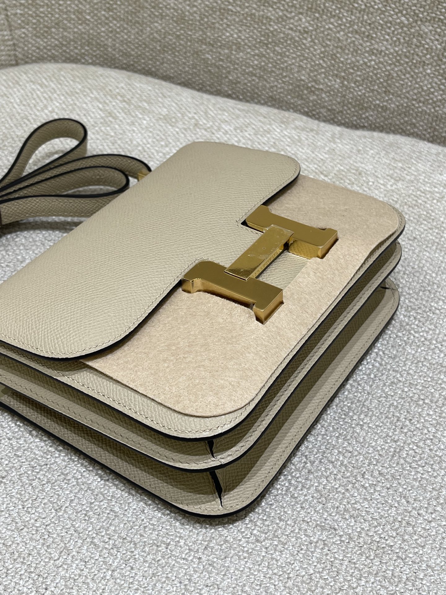 Hermès Model: Constance 19 Color: Trench Gray with Gold Hardware Dimensions: 19cm x 15cm x 4cm