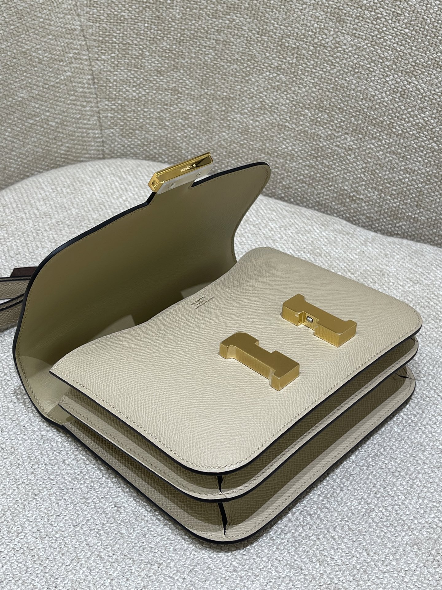 Hermès Model: Constance 19 Color: Trench Gray with Gold Hardware Dimensions: 19cm x 15cm x 4cm