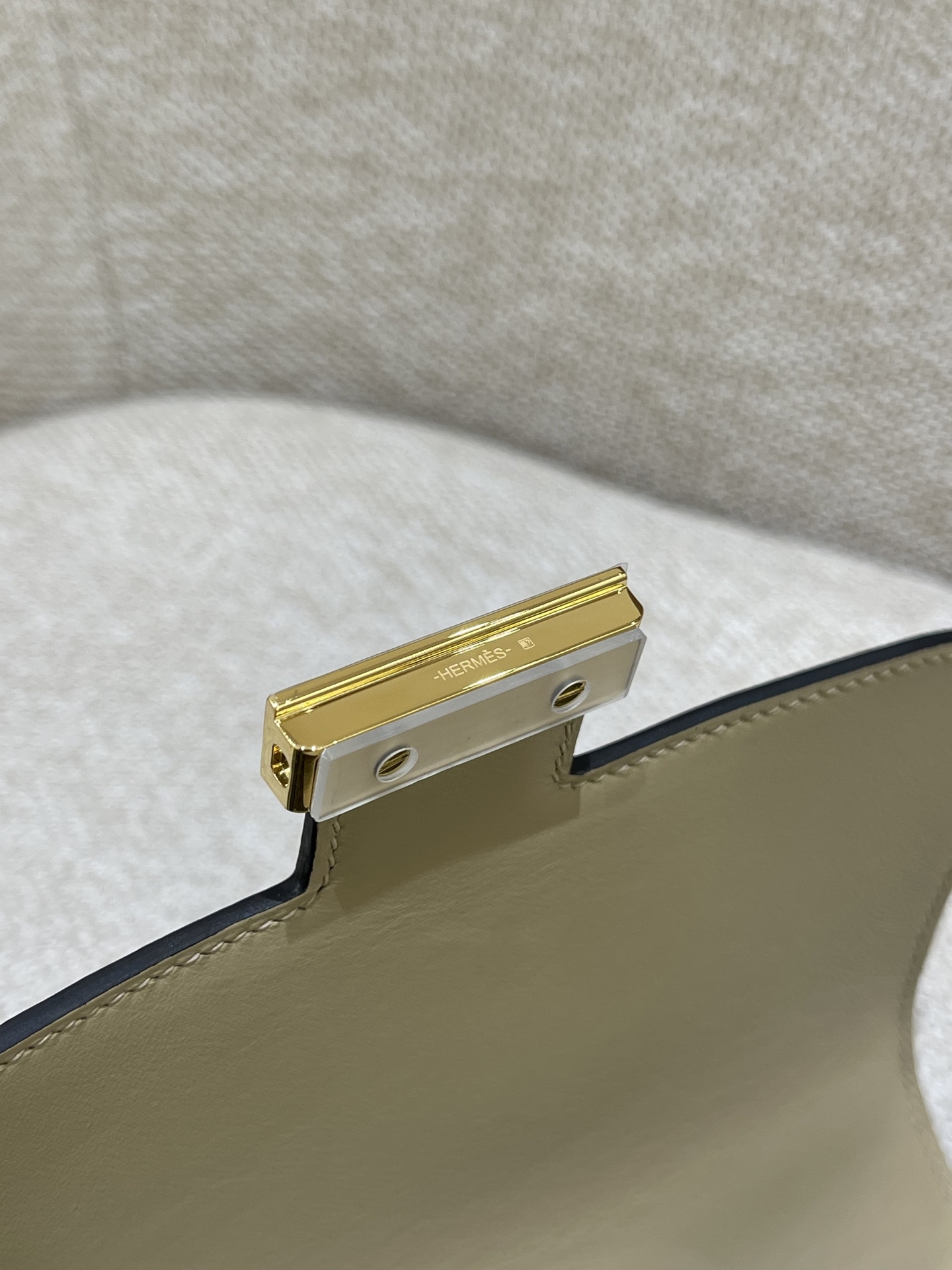 Hermès Model: Constance 19 Color: Trench Gray with Gold Hardware Dimensions: 19cm x 15cm x 4cm