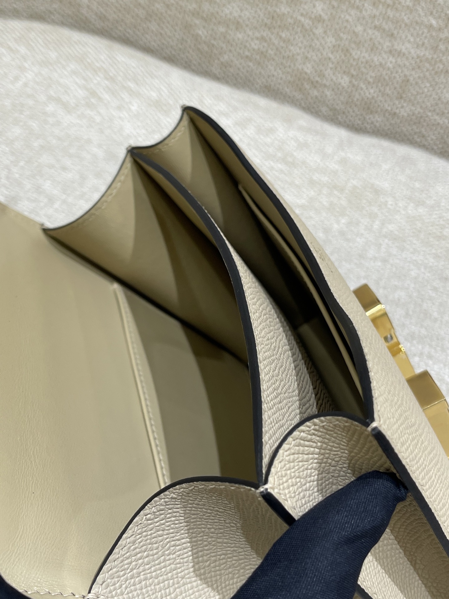 Hermès Model: Constance 19 Color: Trench Gray with Gold Hardware Dimensions: 19cm x 15cm x 4cm