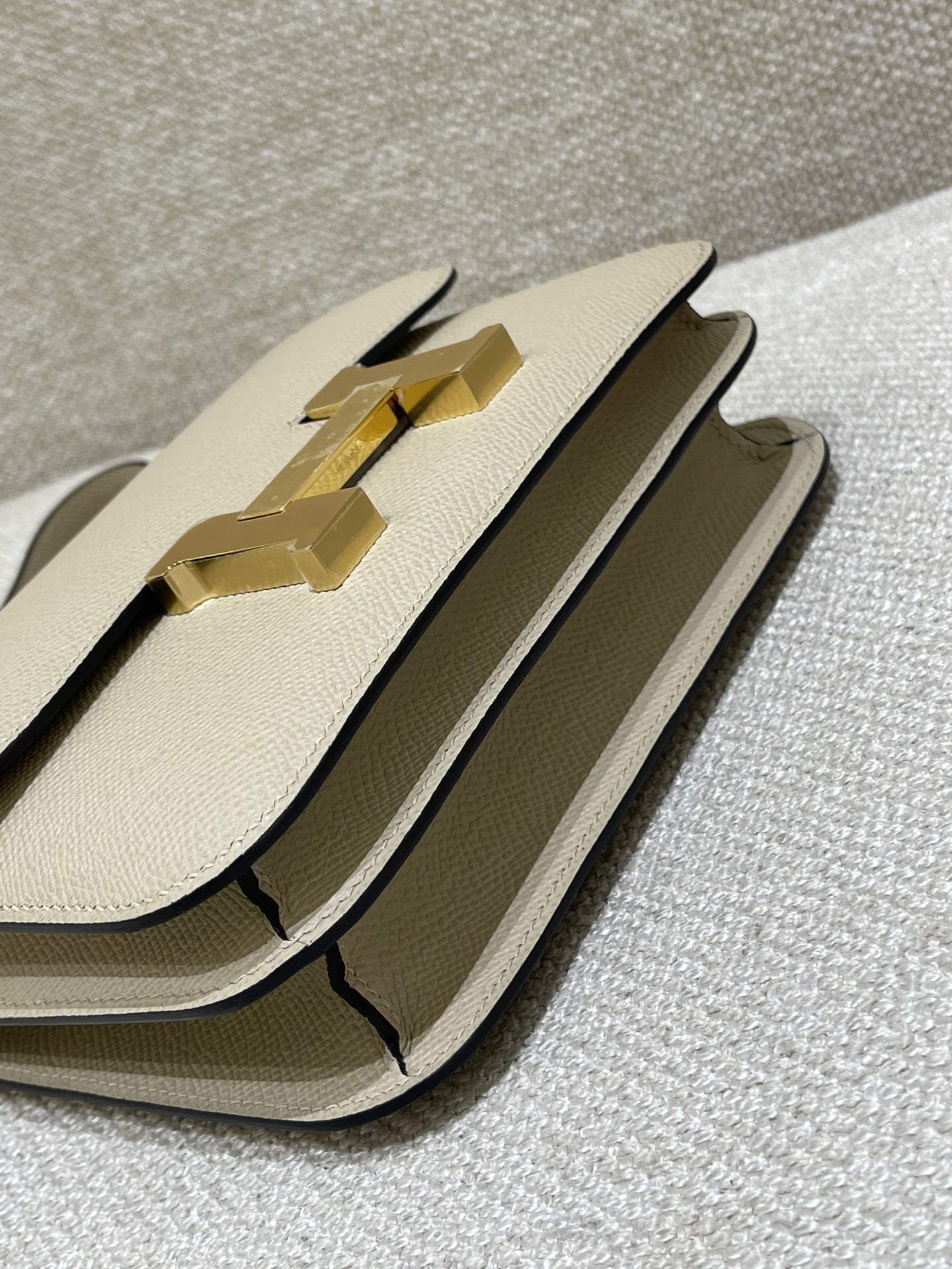 Hermès Model: Constance 19 Color: Trench Gray with Gold Hardware Dimensions: 19cm x 15cm x 4cm