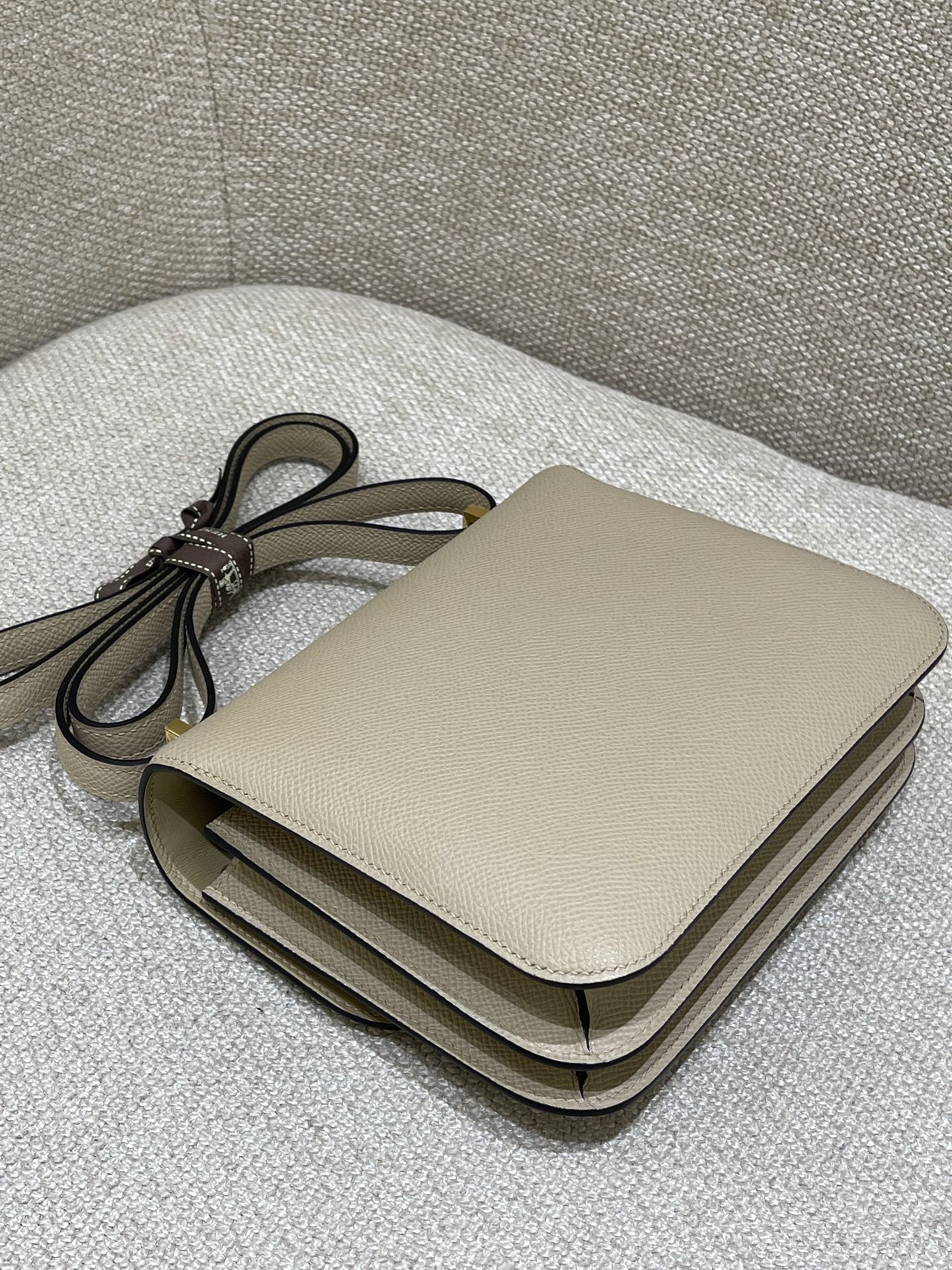 Hermès Model: Constance 19 Color: Trench Gray with Gold Hardware Dimensions: 19cm x 15cm x 4cm