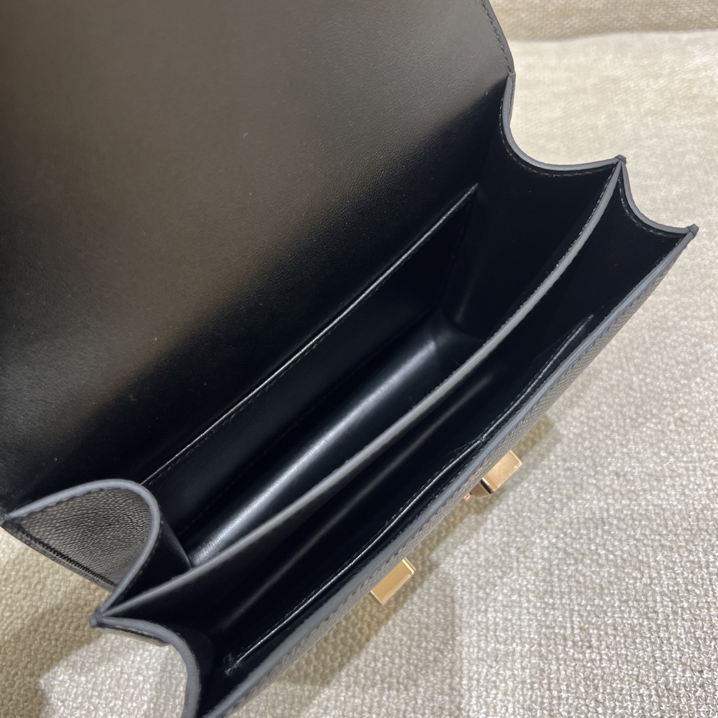 Hermès Model: Constance 19 Color: Black with rose gold hardware Dimensions: 19cm x 15cm x 4cm