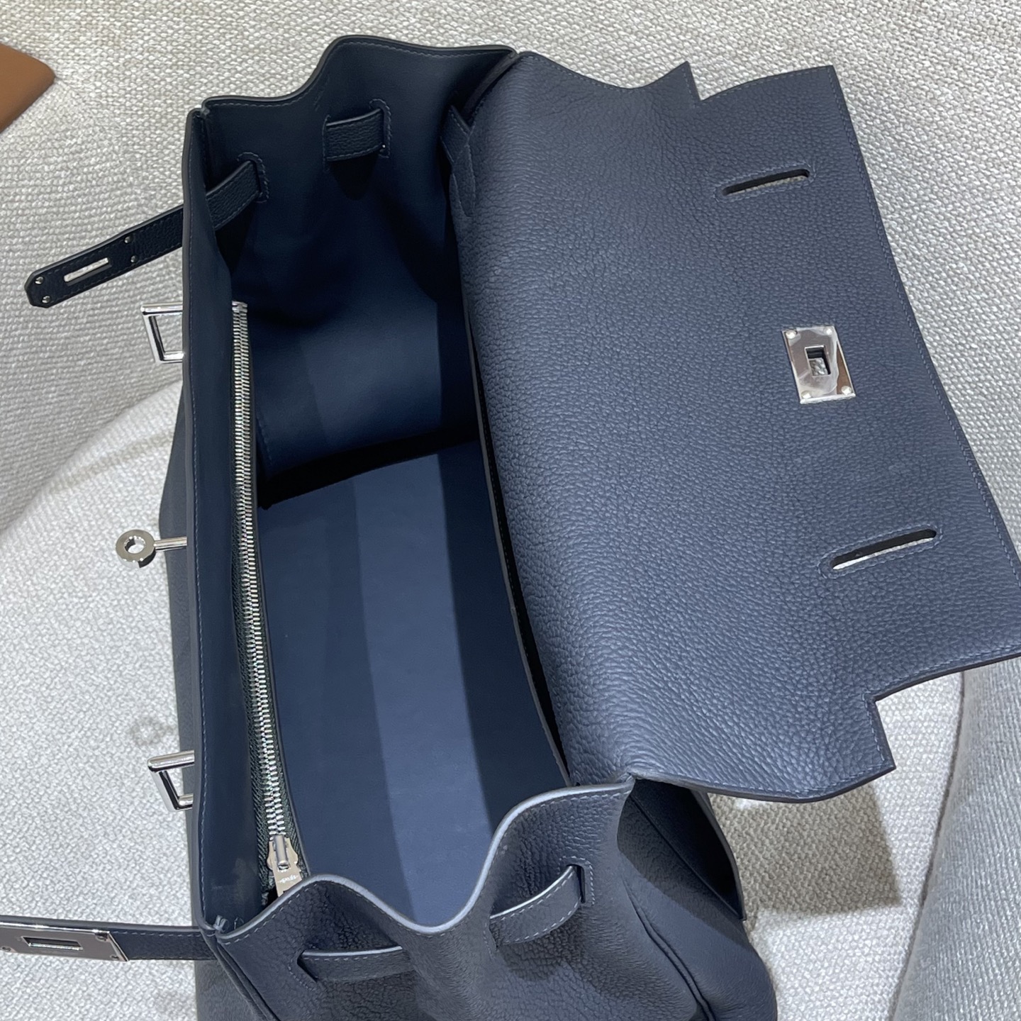 Hermès Model: Kelly Maxi 42 Color: Black with silver hardware Dimensions: 42 × 30 × 14 cm (including handles)