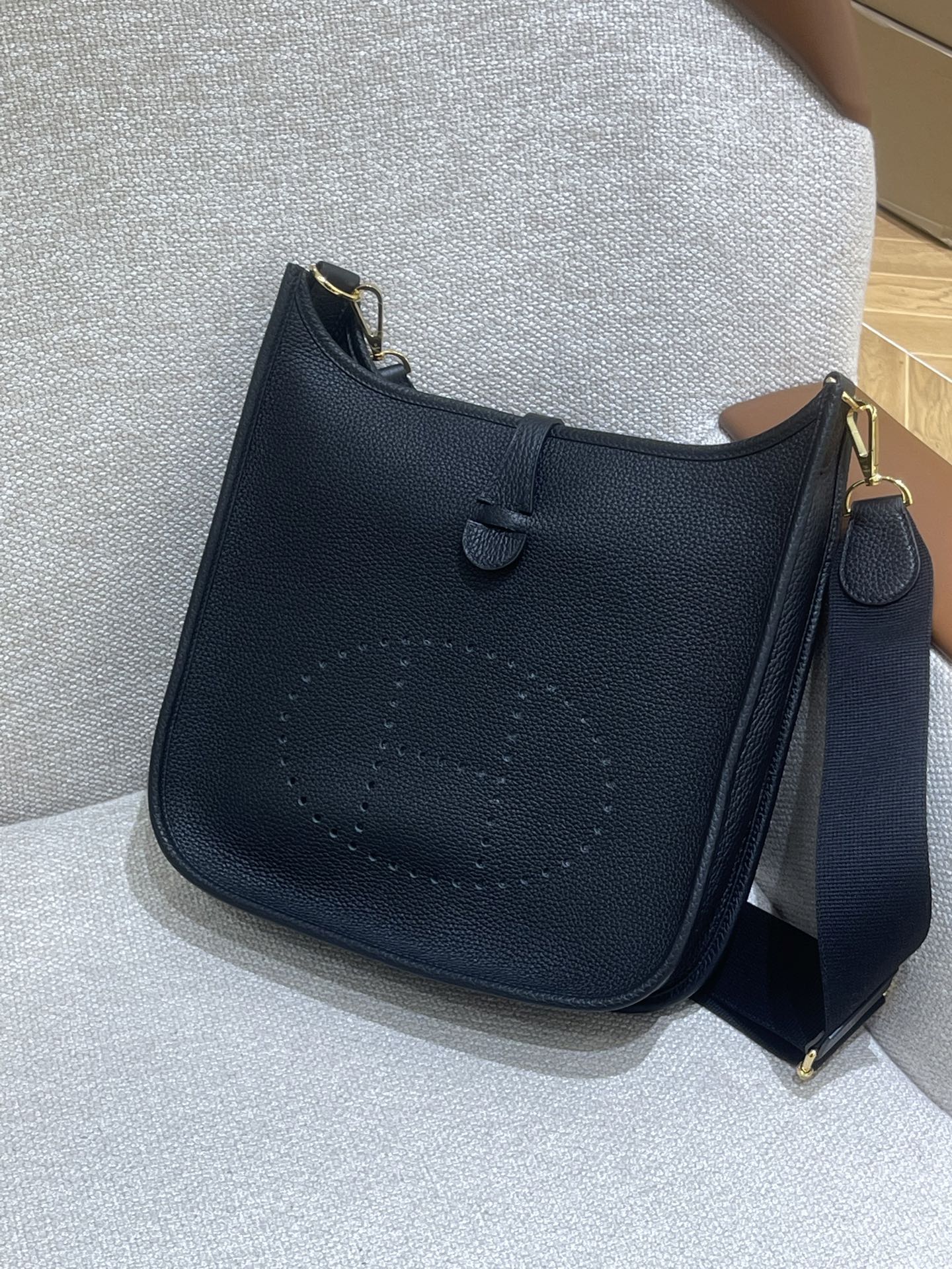 Hermès Model: Mini Evelyne Color: Black with Gold Hardware Dimensions: 29cm x 30cm x 9cm