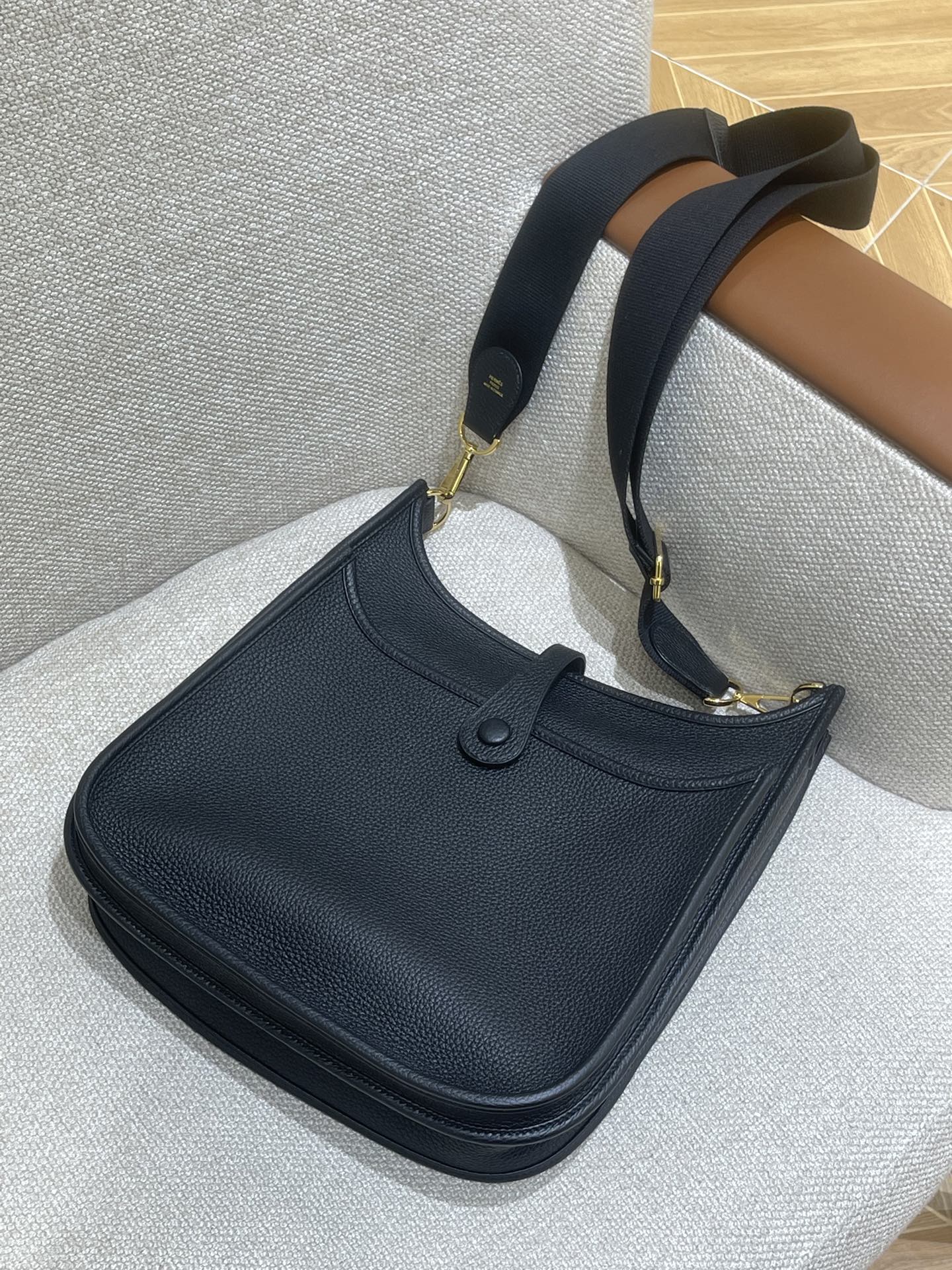 Hermès Model: Mini Evelyne Color: Black with Gold Hardware Dimensions: 29cm x 30cm x 9cm