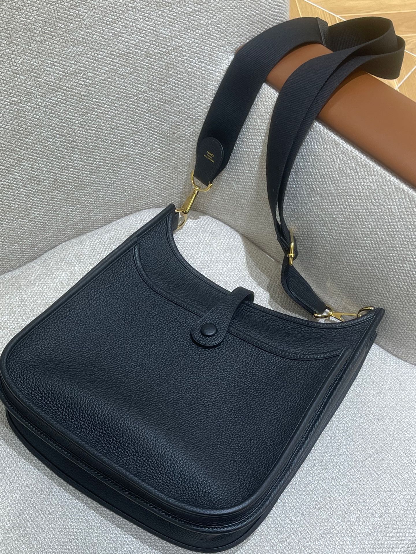 Hermès Model: Mini Evelyne Color: Black with Gold Hardware Dimensions: 29cm x 30cm x 9cm