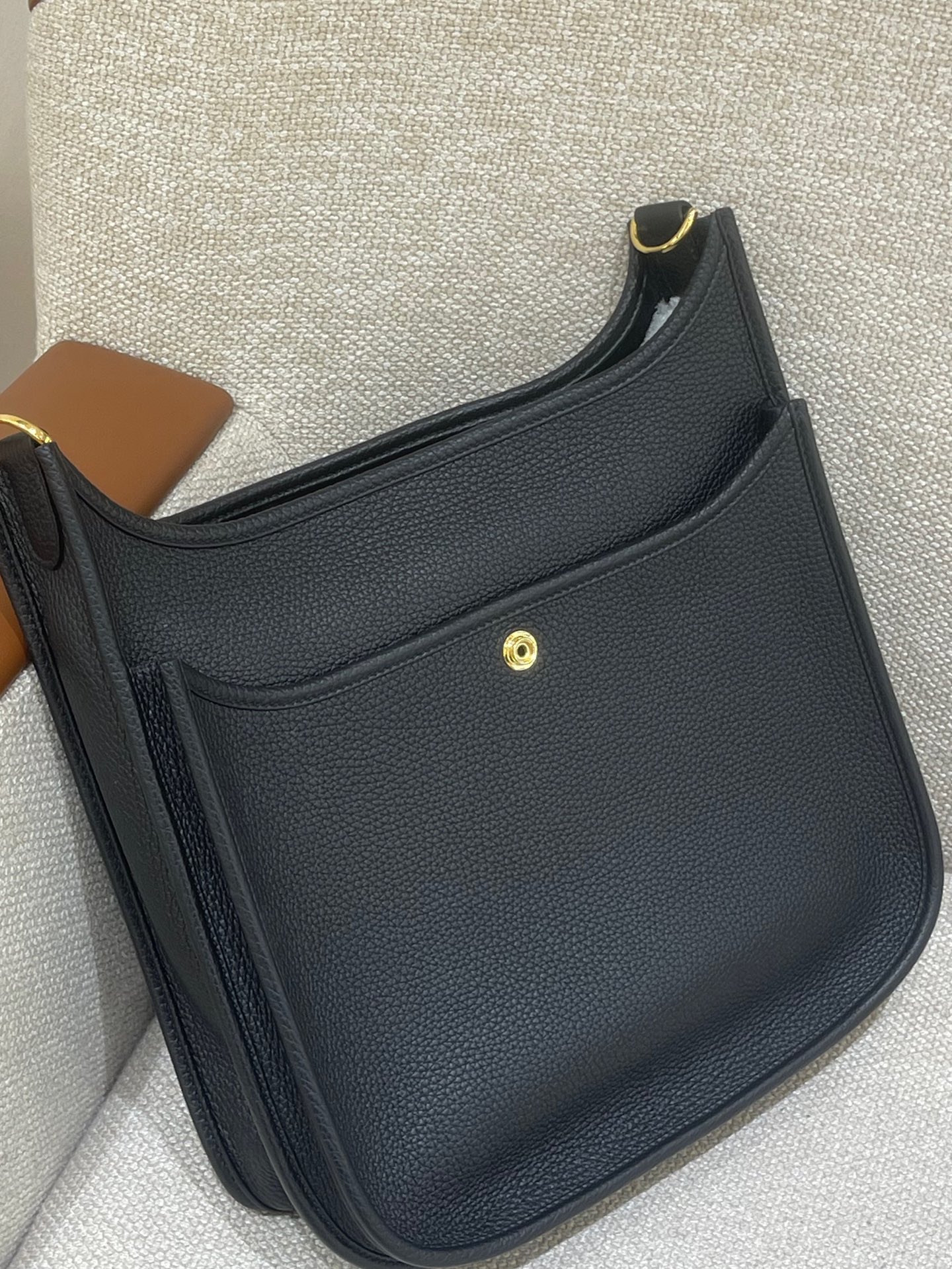 Hermès Model: Mini Evelyne Color: Black with Gold Hardware Dimensions: 29cm x 30cm x 9cm