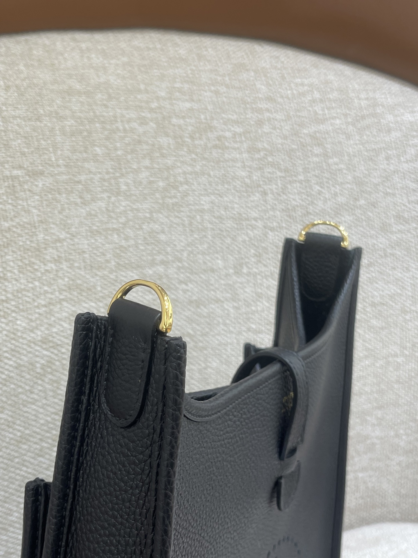 Hermès Model: Mini Evelyne Color: Black with Gold Hardware Dimensions: 29cm x 30cm x 9cm