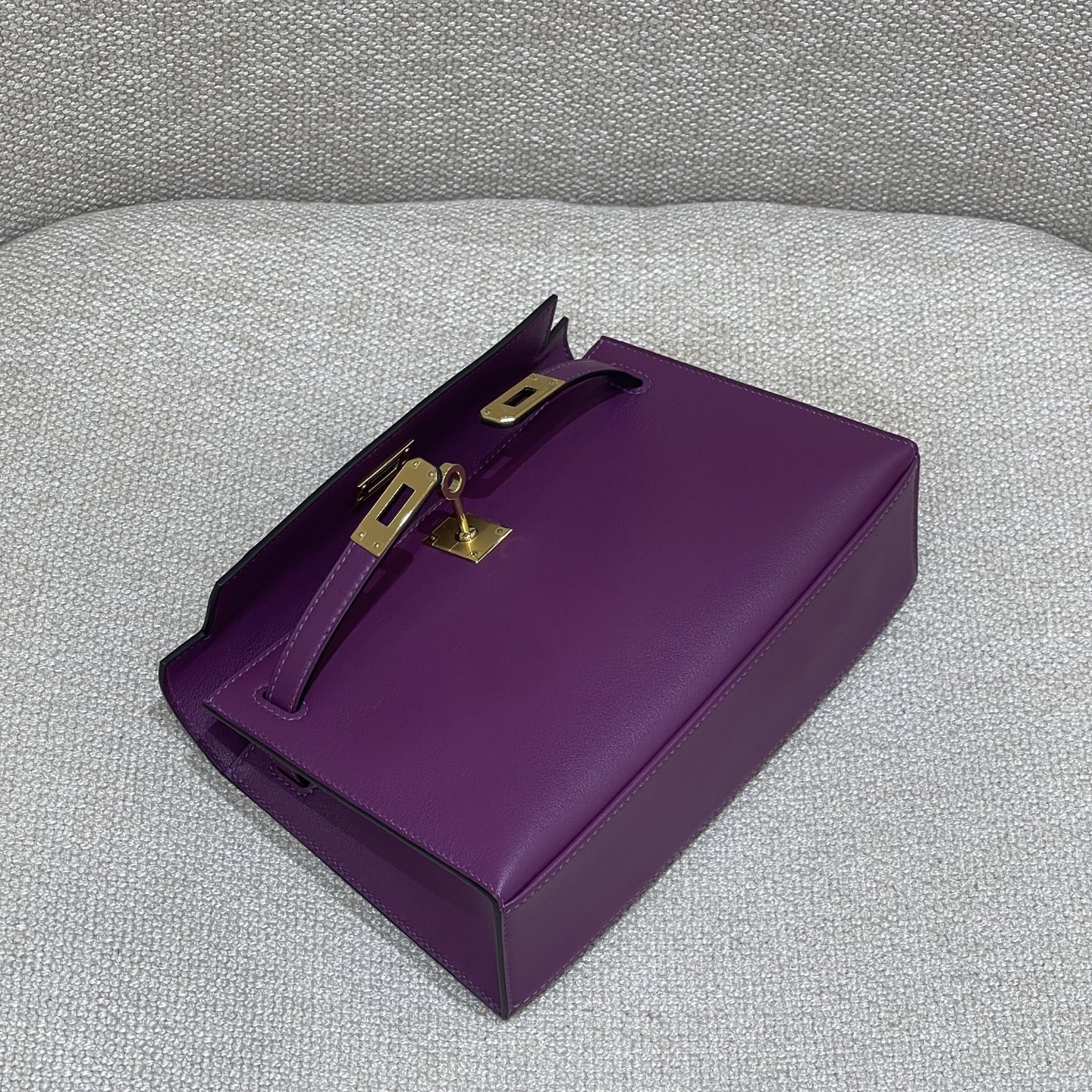 Hermès Model: Kelly Mini First Generation Color: Anemone Purple with Gold Hardware Dimensions: 22cm x 14cm x 7cm