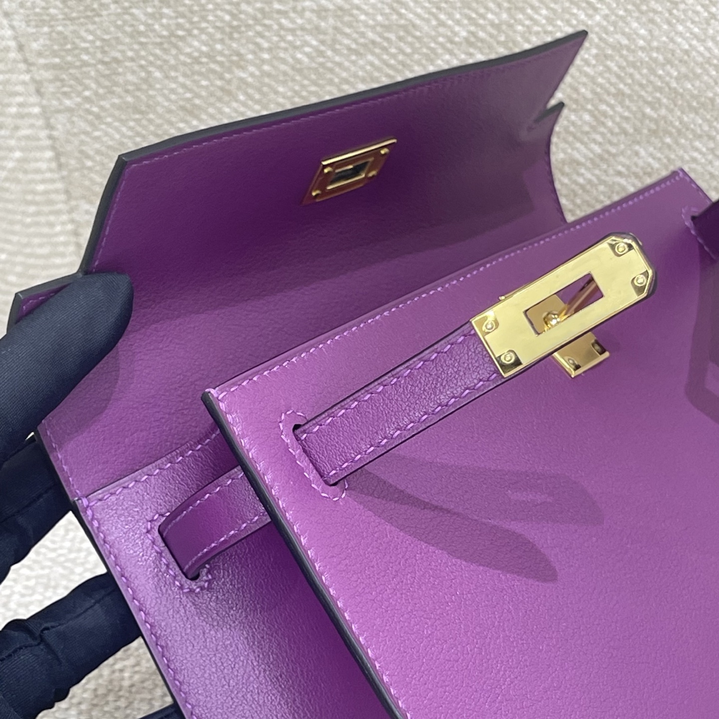 Hermès Model: Kelly Mini First Generation Color: Anemone Purple with Gold Hardware Dimensions: 22cm x 14cm x 7cm
