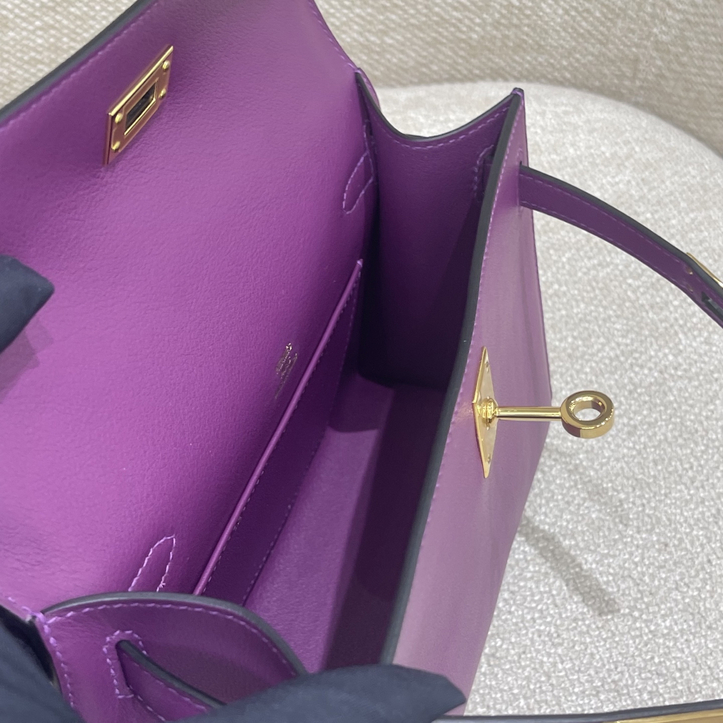 Hermès Model: Kelly Mini First Generation Color: Anemone Purple with Gold Hardware Dimensions: 22cm x 14cm x 7cm