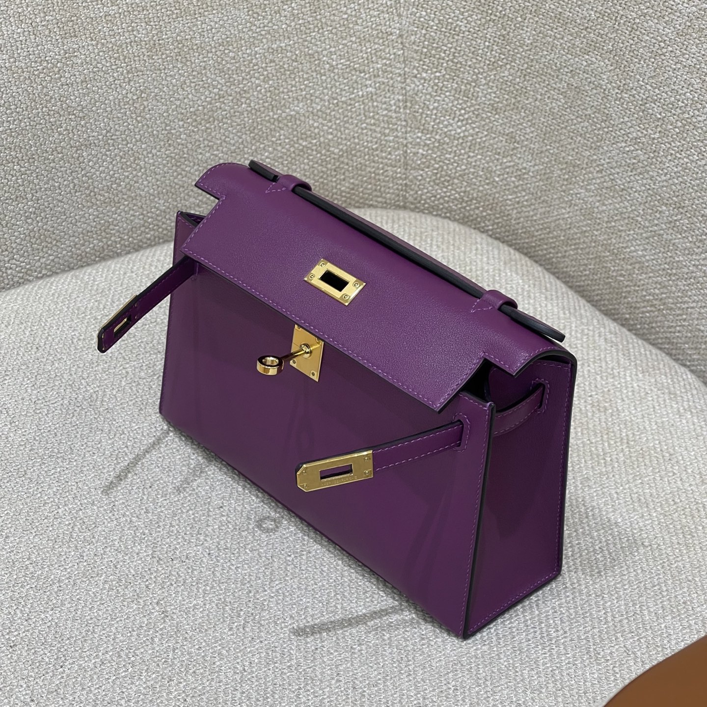 Hermès Model: Kelly Mini First Generation Color: Anemone Purple with Gold Hardware Dimensions: 22cm x 14cm x 7cm