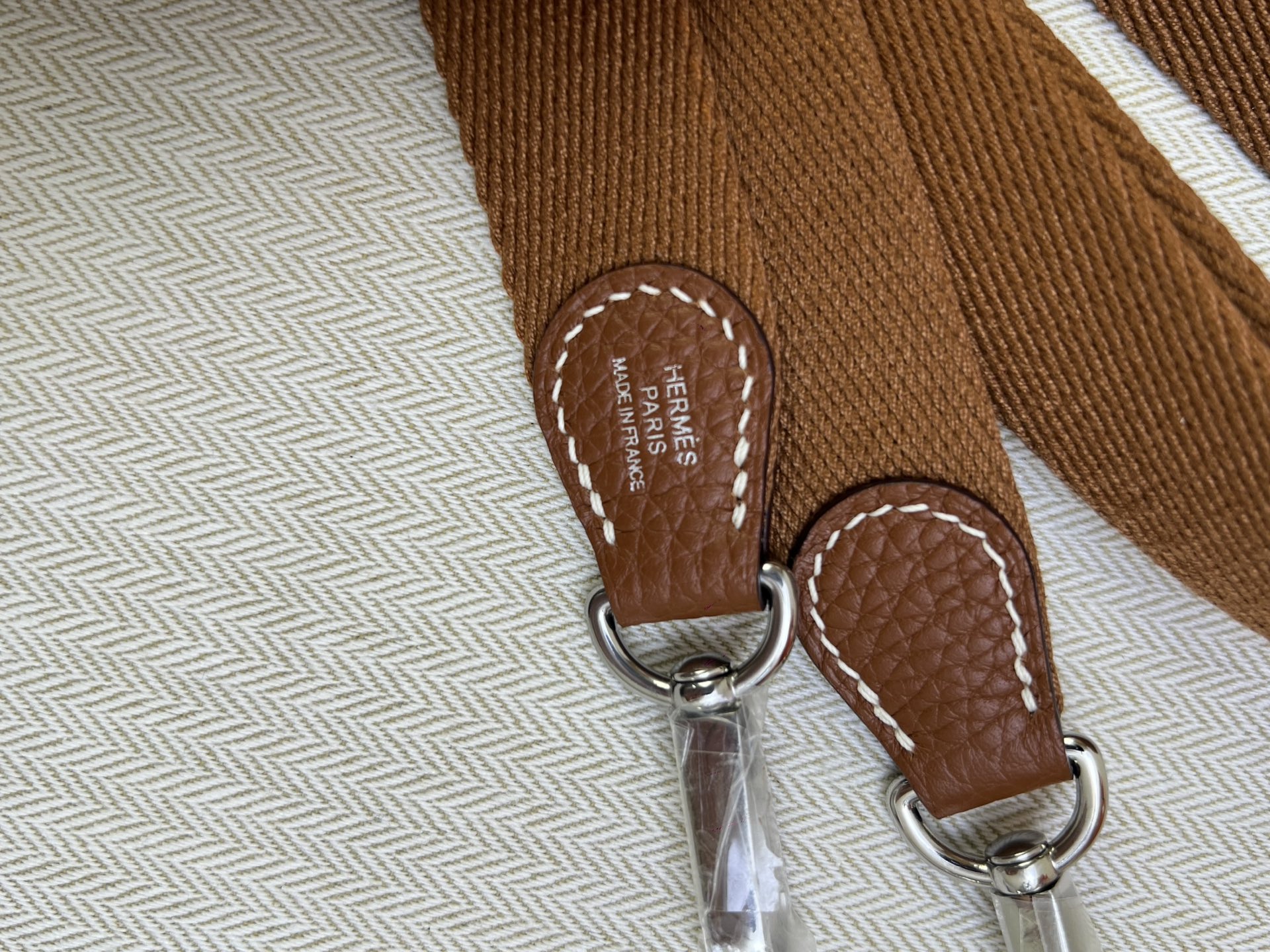 Hermès Model: Mini Evelyne Color: Golden Brown with Silver Buckle Dimensions: 16cm x 18cm x 5cm