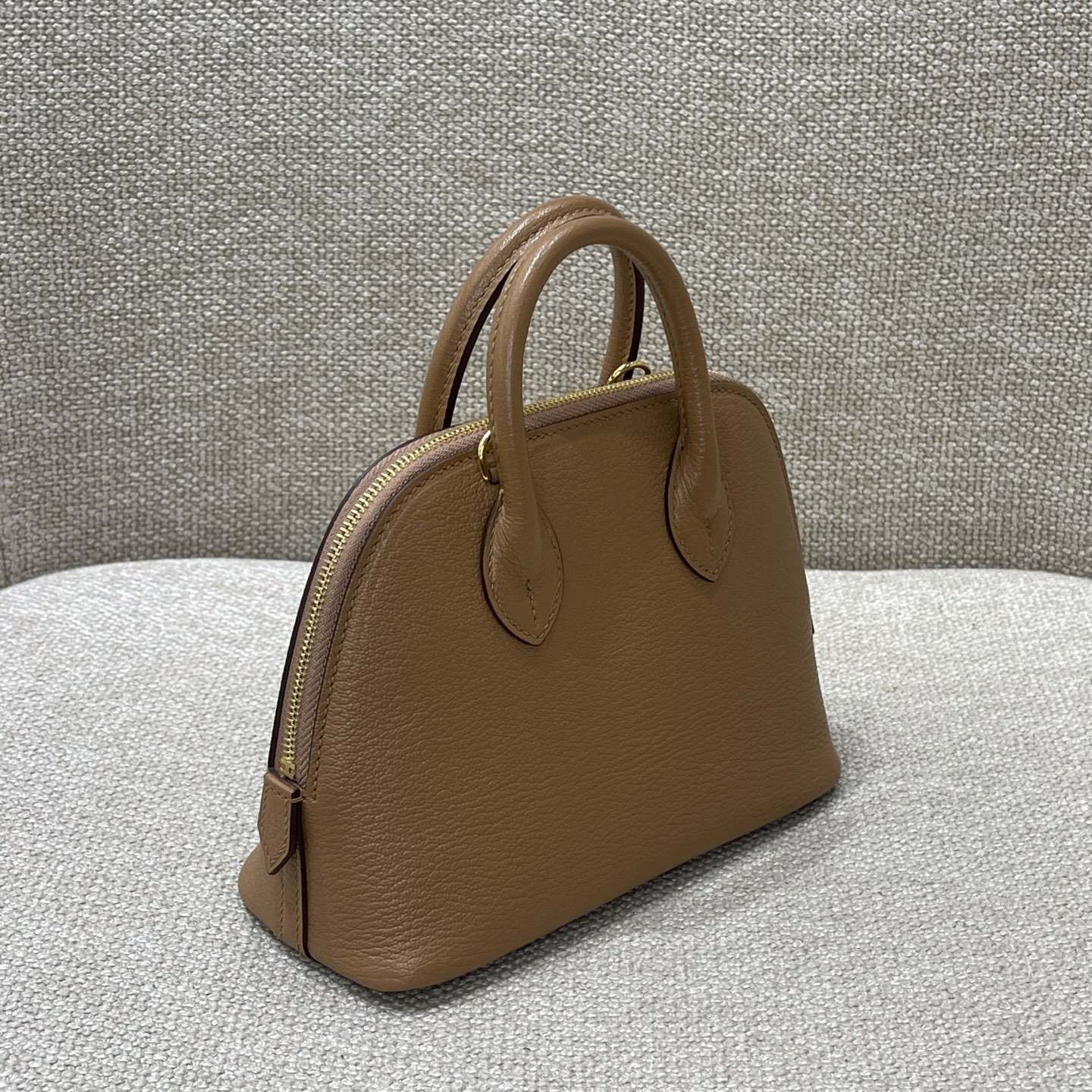 Hermès Model: Mini Bolide Color: Hazel Wood, Gold Dimensions: 18cm x 7cm x 20cm (including handle)