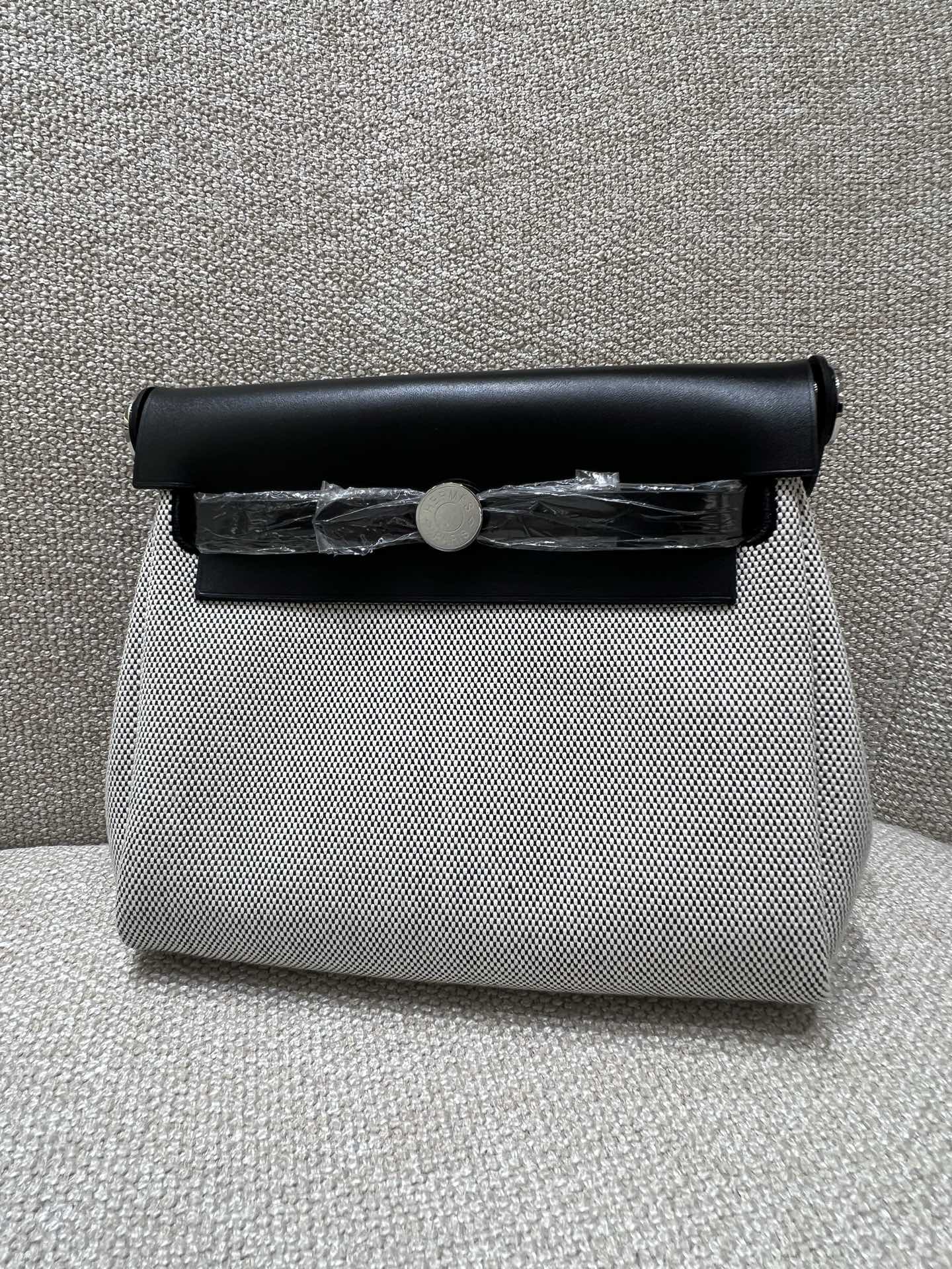 Hermès Model: Mini Herbag Color: Panda Black with Silver Hardware Dimensions: 20*17*7cm