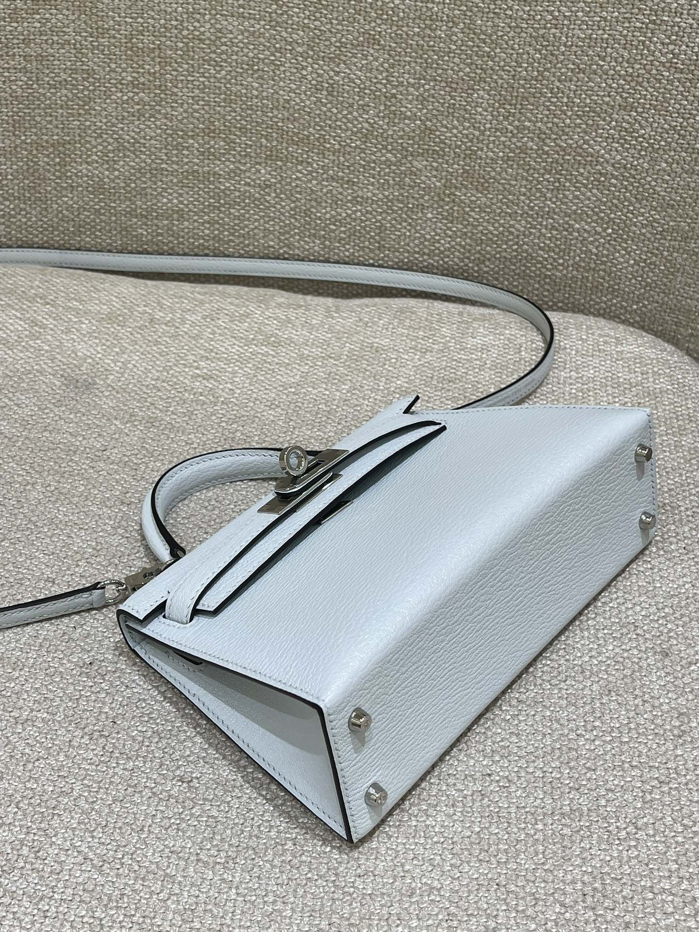 Hermès Model: Kelly Mini 2nd Generation Color: Smoky Blue with Silver Hardware Dimensions: 19cm x 12cm x 5.5cm