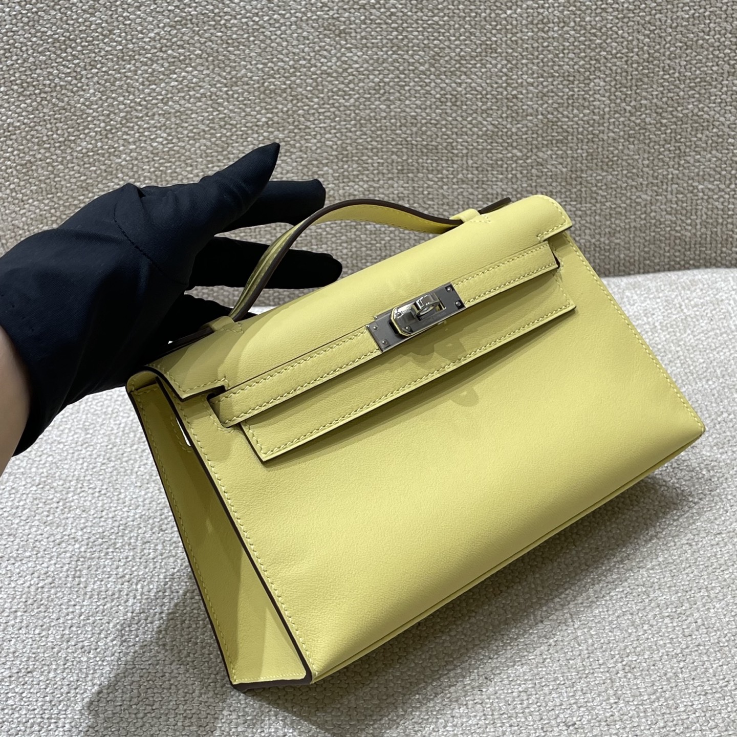 Hermès Model: Kelly Mini First Generation Color: Chick Yellow with Silver Hardware Dimensions: 22cm x 14cm x 7cm