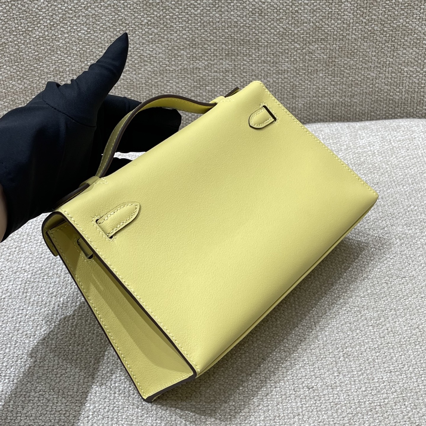 Hermès Model: Kelly Mini First Generation Color: Chick Yellow with Silver Hardware Dimensions: 22cm x 14cm x 7cm