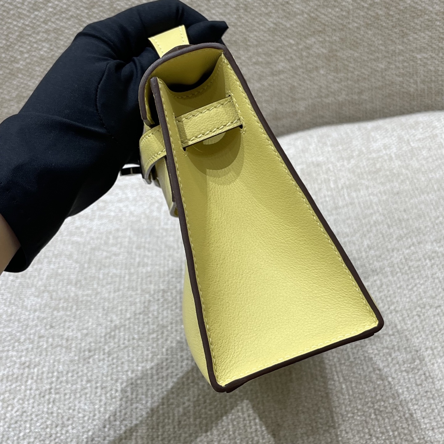 Hermès Model: Kelly Mini First Generation Color: Chick Yellow with Silver Hardware Dimensions: 22cm x 14cm x 7cm