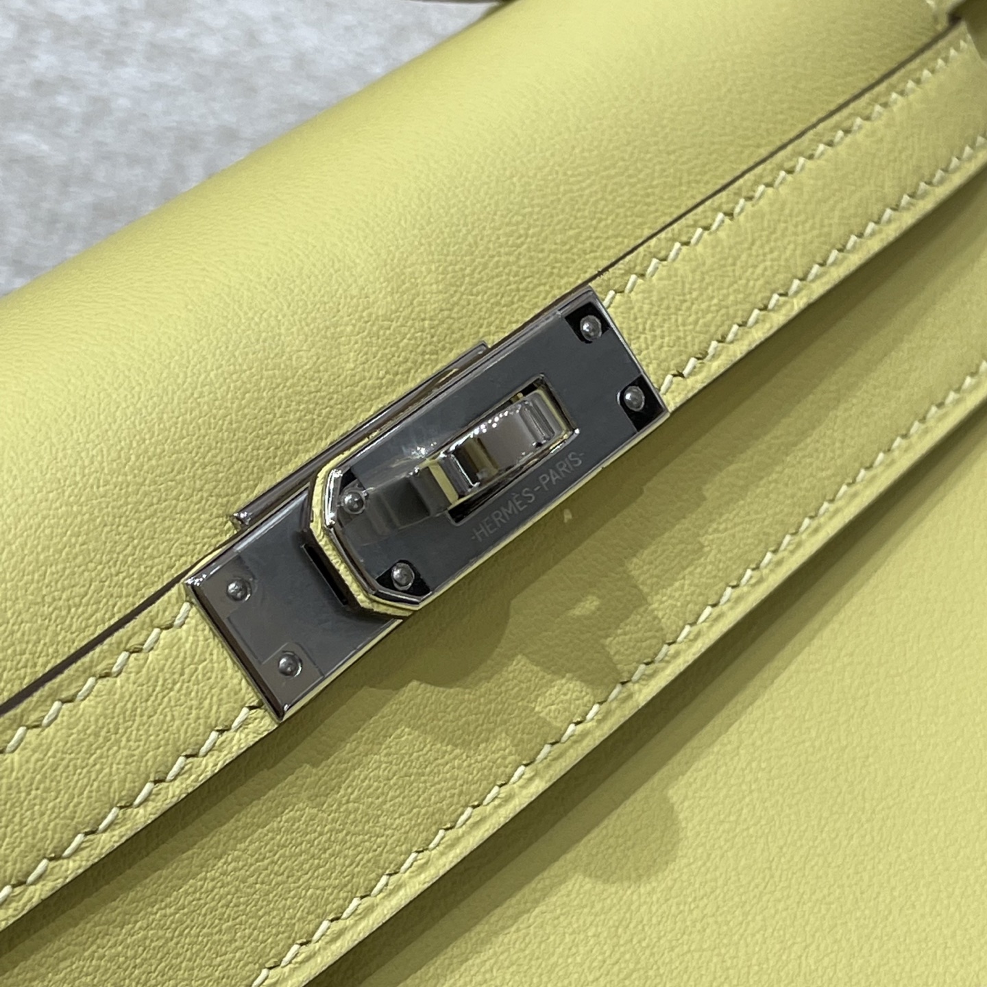 Hermès Model: Kelly Mini First Generation Color: Chick Yellow with Silver Hardware Dimensions: 22cm x 14cm x 7cm