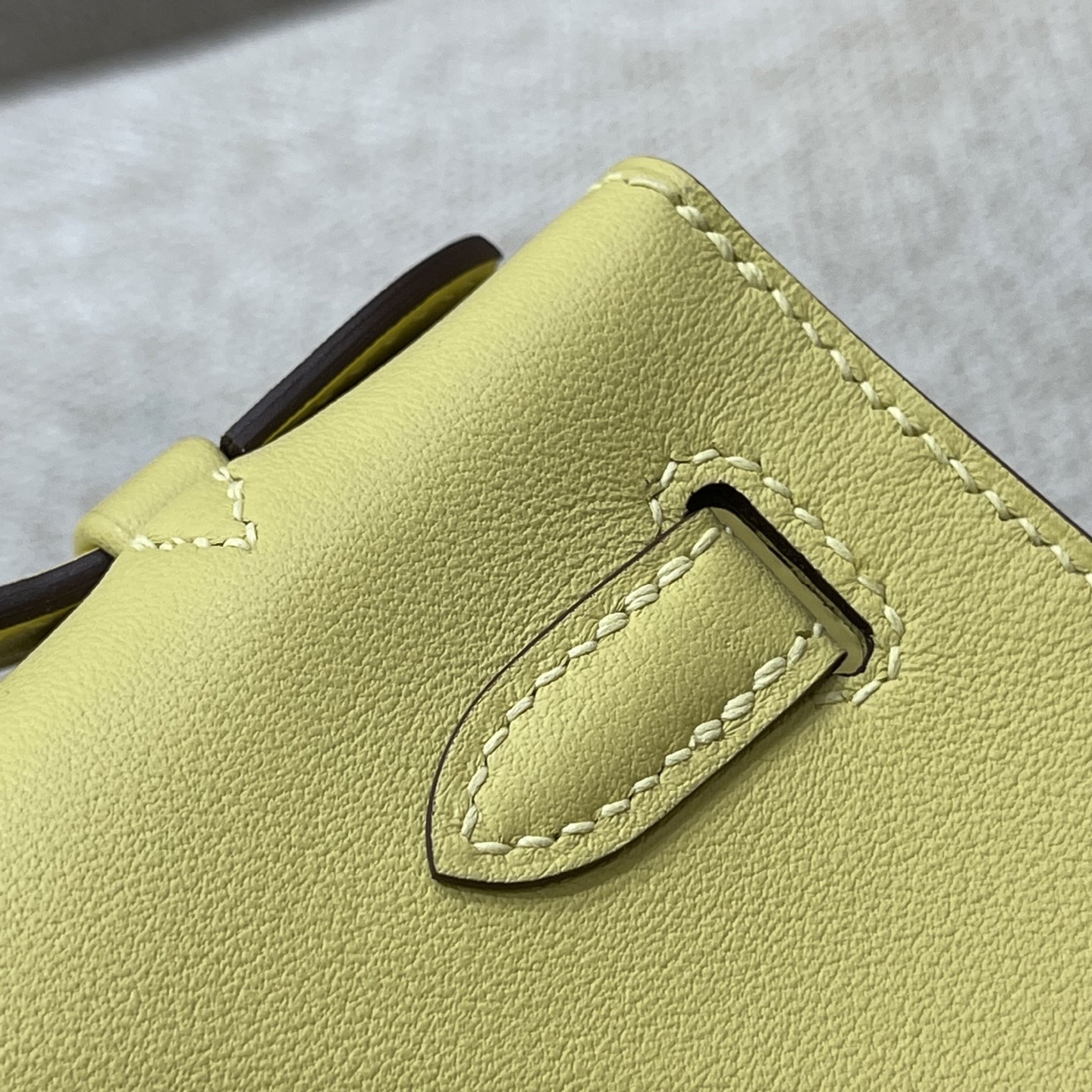 Hermès Model: Kelly Mini First Generation Color: Chick Yellow with Silver Hardware Dimensions: 22cm x 14cm x 7cm