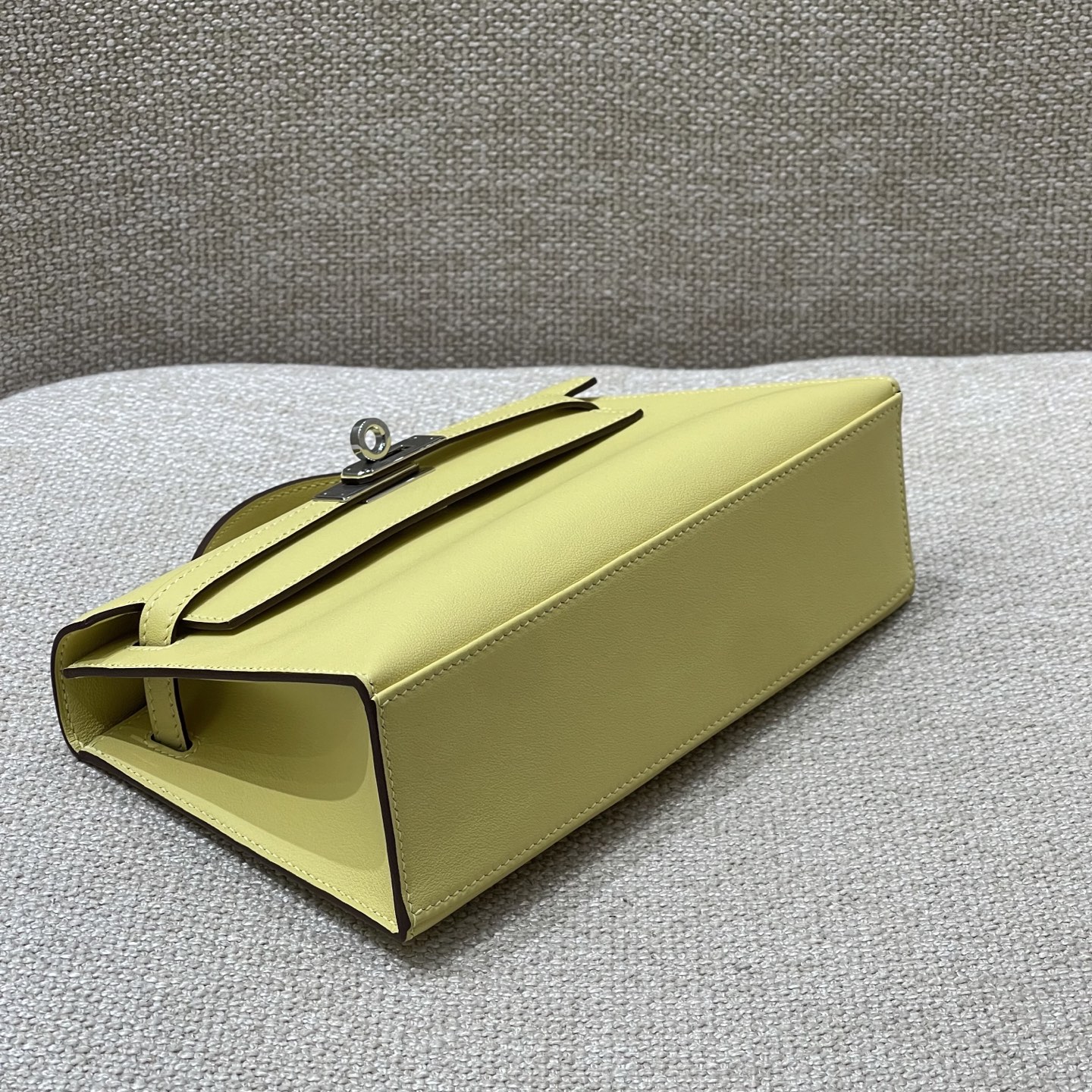 Hermès Model: Kelly Mini First Generation Color: Chick Yellow with Silver Hardware Dimensions: 22cm x 14cm x 7cm