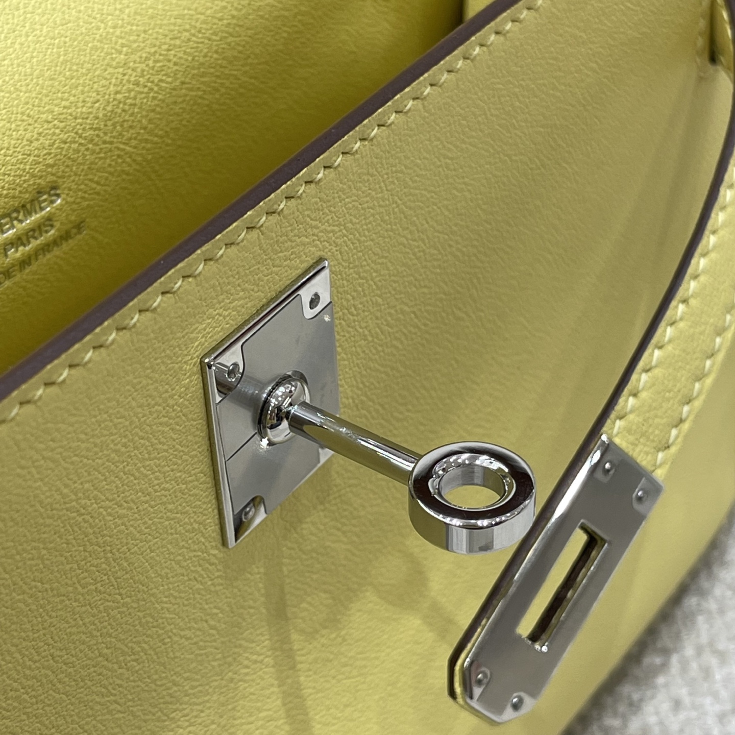 Hermès Model: Kelly Mini First Generation Color: Chick Yellow with Silver Hardware Dimensions: 22cm x 14cm x 7cm