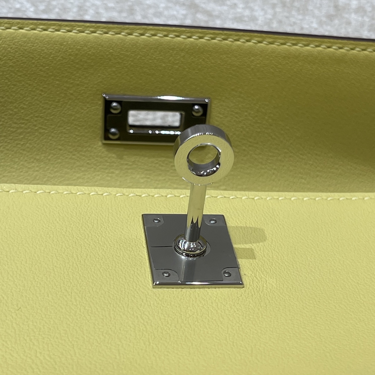 Hermès Model: Kelly Mini First Generation Color: Chick Yellow with Silver Hardware Dimensions: 22cm x 14cm x 7cm