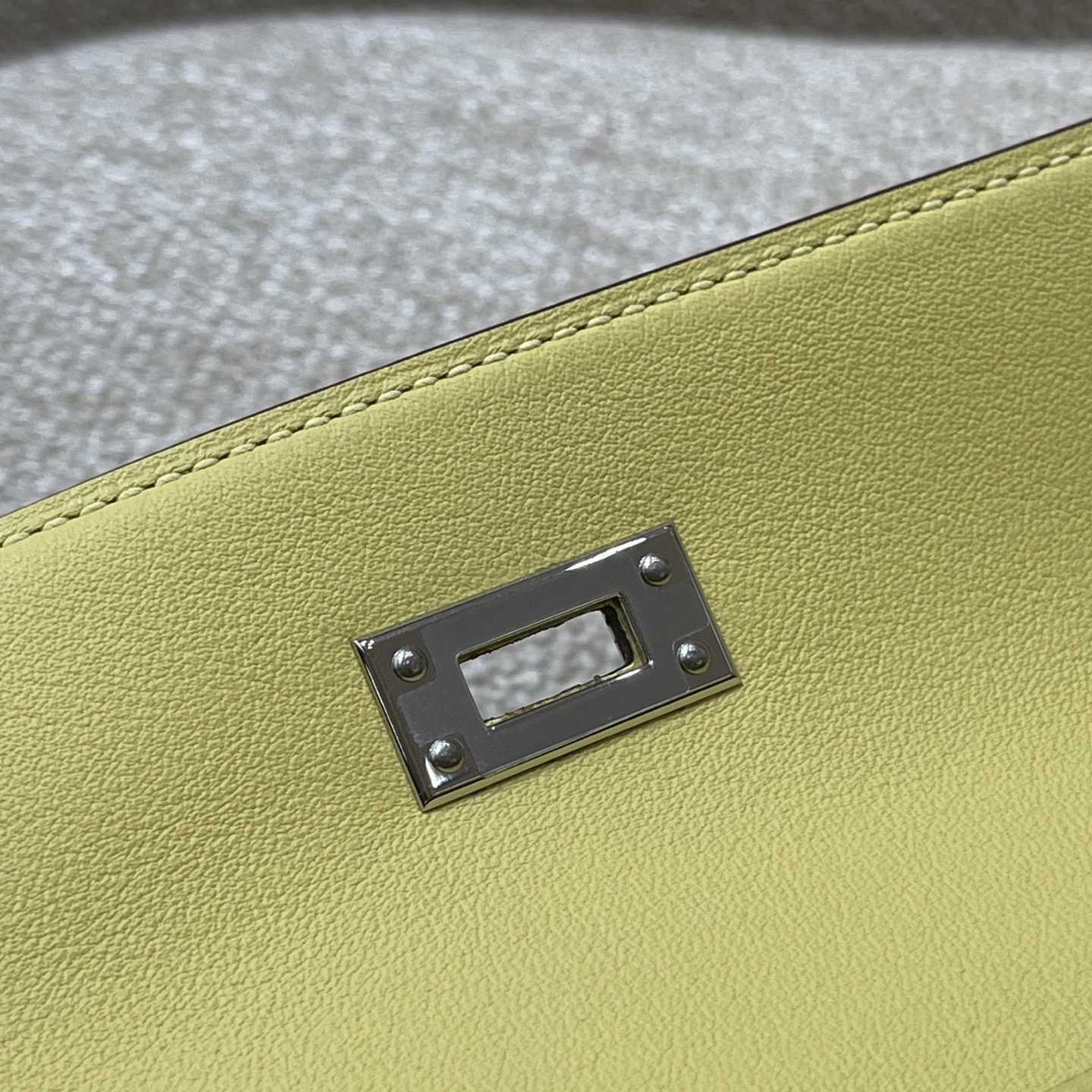 Hermès Model: Kelly Mini First Generation Color: Chick Yellow with Silver Hardware Dimensions: 22cm x 14cm x 7cm