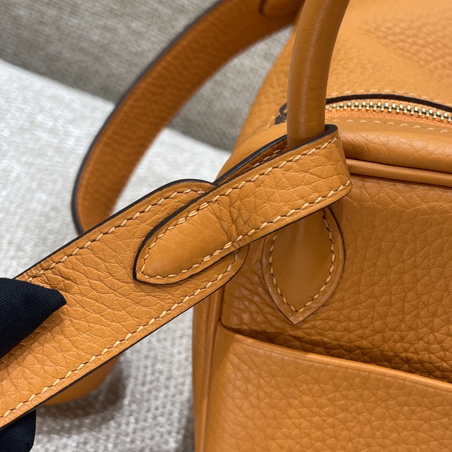 Hermès Model: Lindy mini Color: Hermès Orange with Gold Buckle Dimensions: 19cm x 12.5cm x 9cm