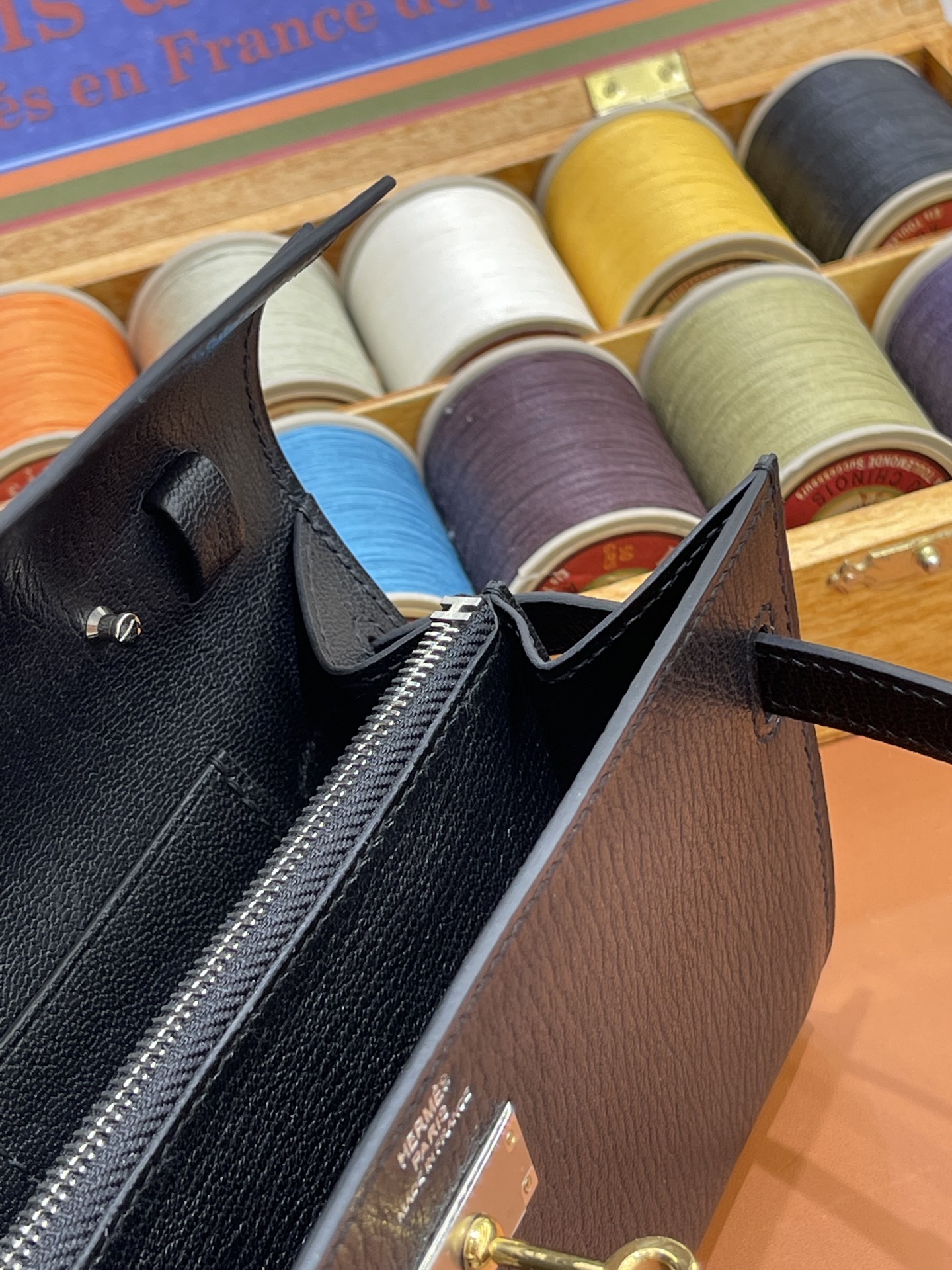 Hermès Model: Kelly ToGo Color: Black with silver hardware Dimensions: 20cm x 11cm x 2cm