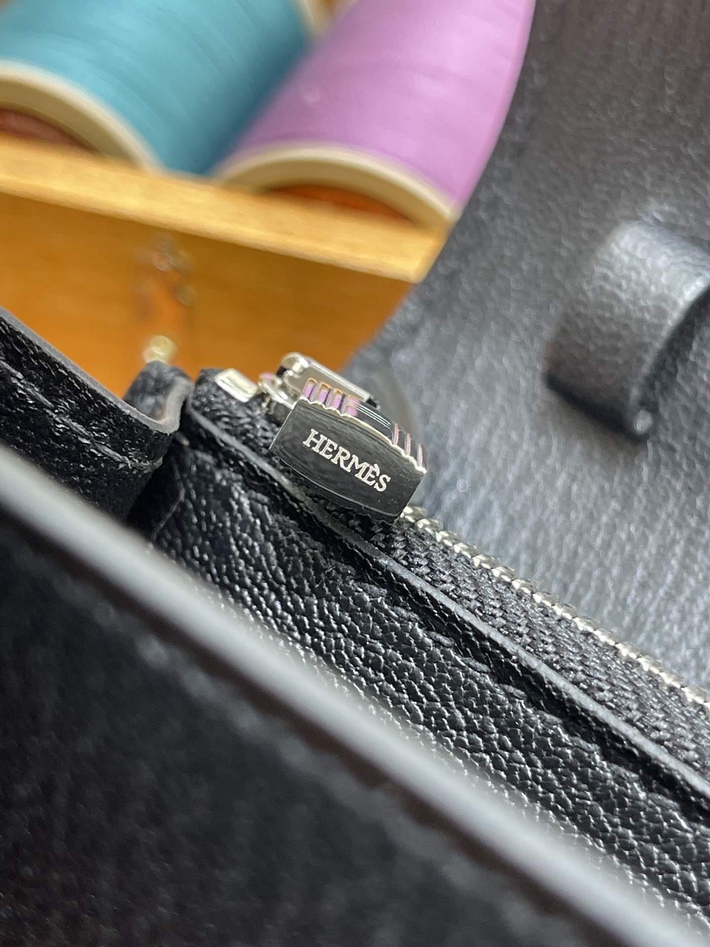 Hermès Model: Kelly ToGo Color: Black with silver hardware Dimensions: 20cm x 11cm x 2cm