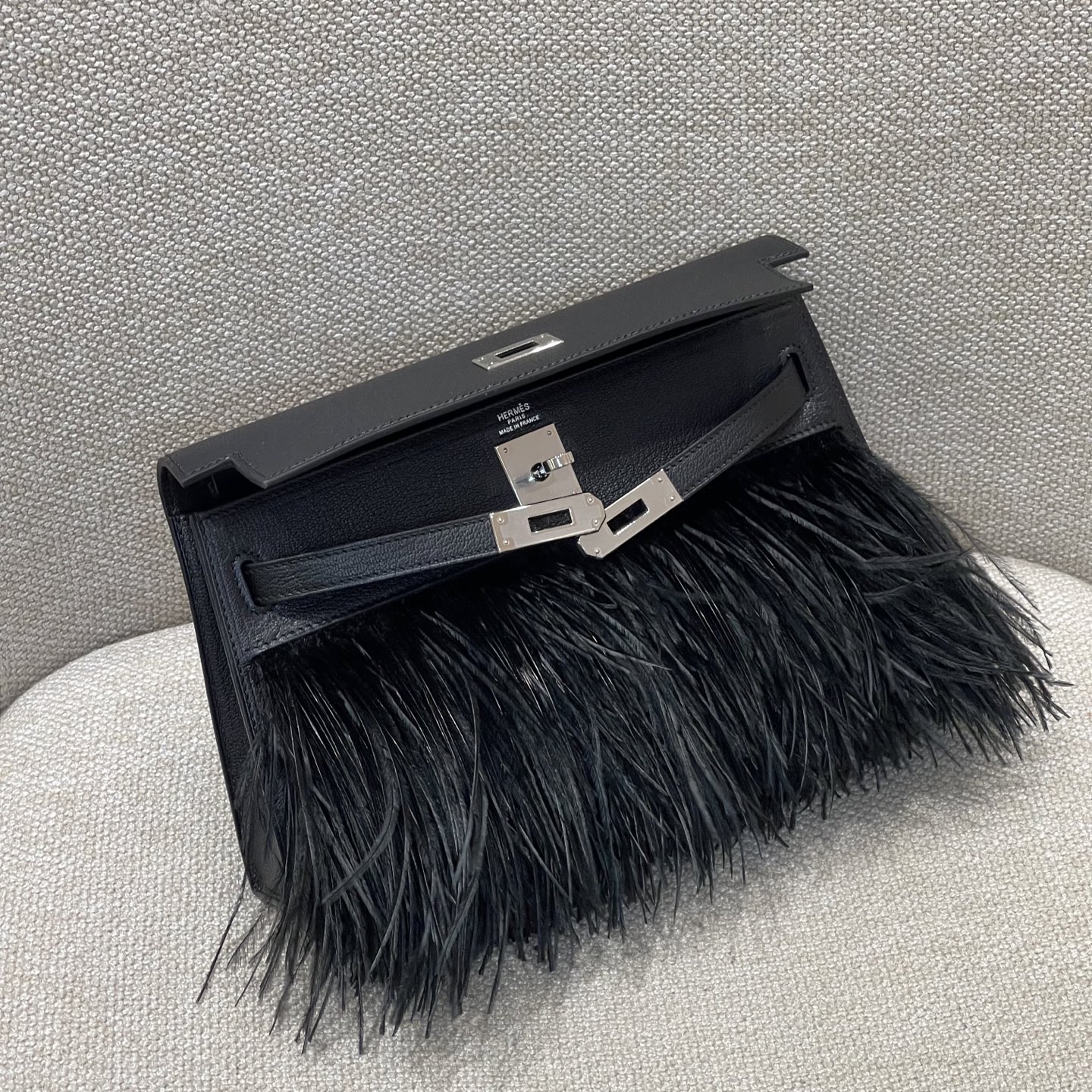 Hermès Model: Kelly Elan Feather Color: Black with Silver Buckle Dimensions: 27.5cm x 15cm x 5cm