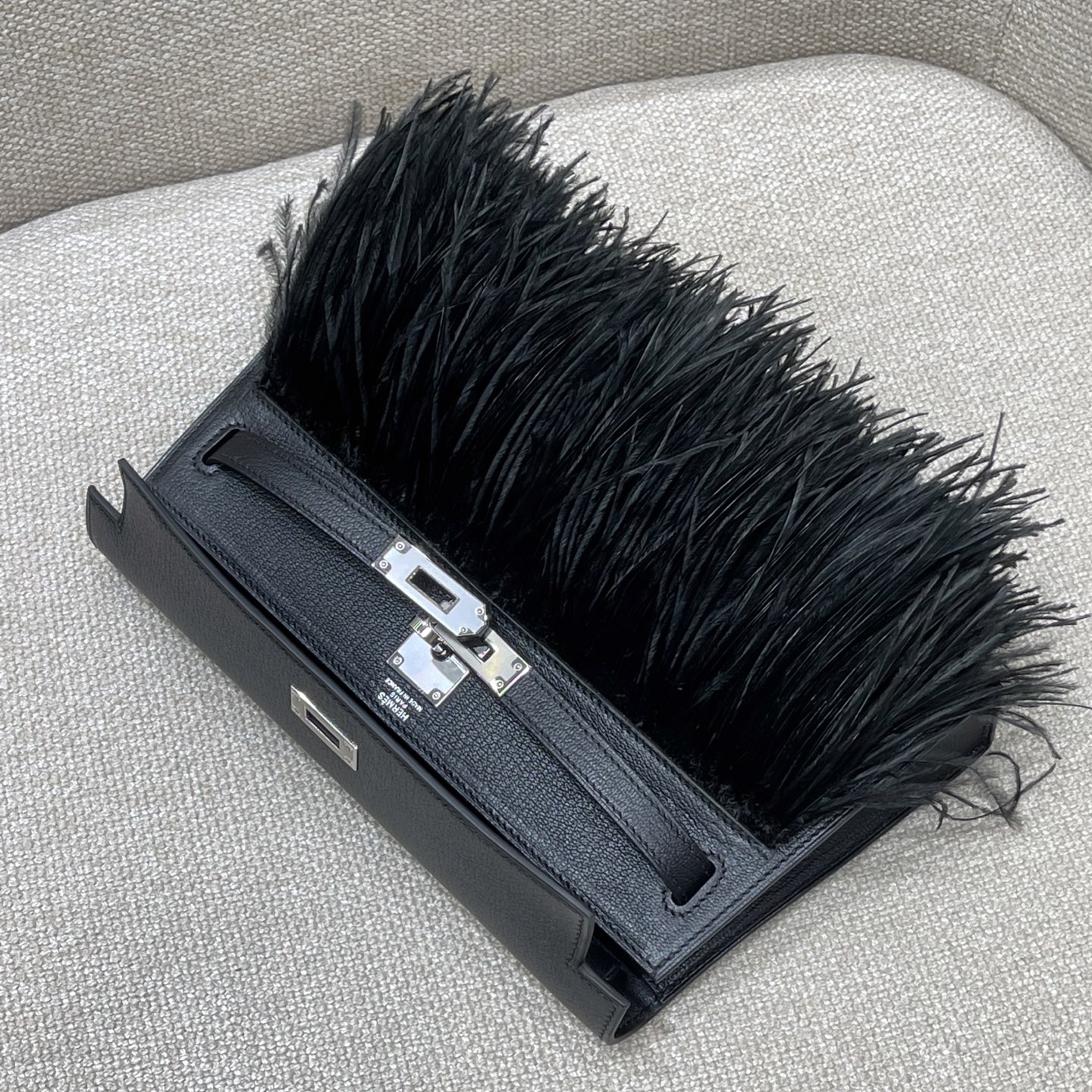 Hermès Model: Kelly Elan Feather Color: Black with Silver Buckle Dimensions: 27.5cm x 15cm x 5cm