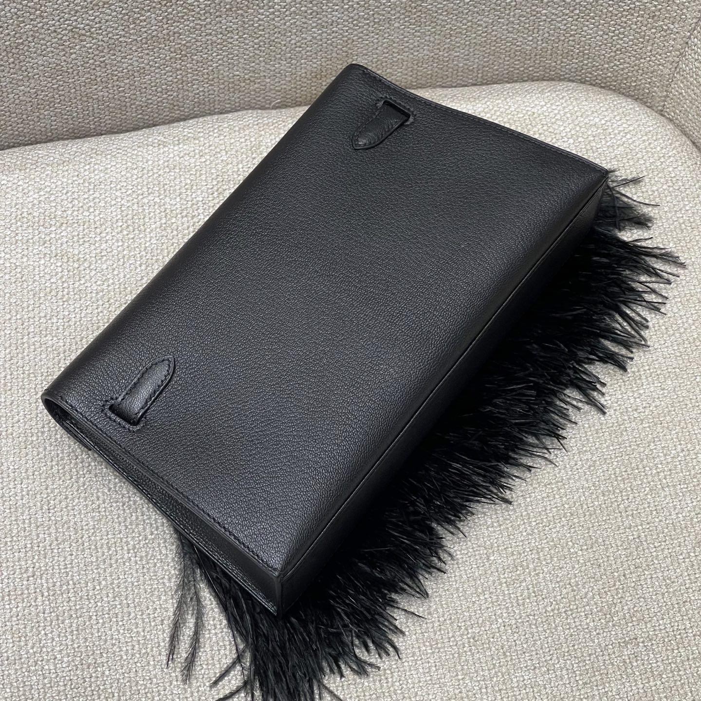 Hermès Model: Kelly Elan Feather Color: Black with Silver Buckle Dimensions: 27.5cm x 15cm x 5cm