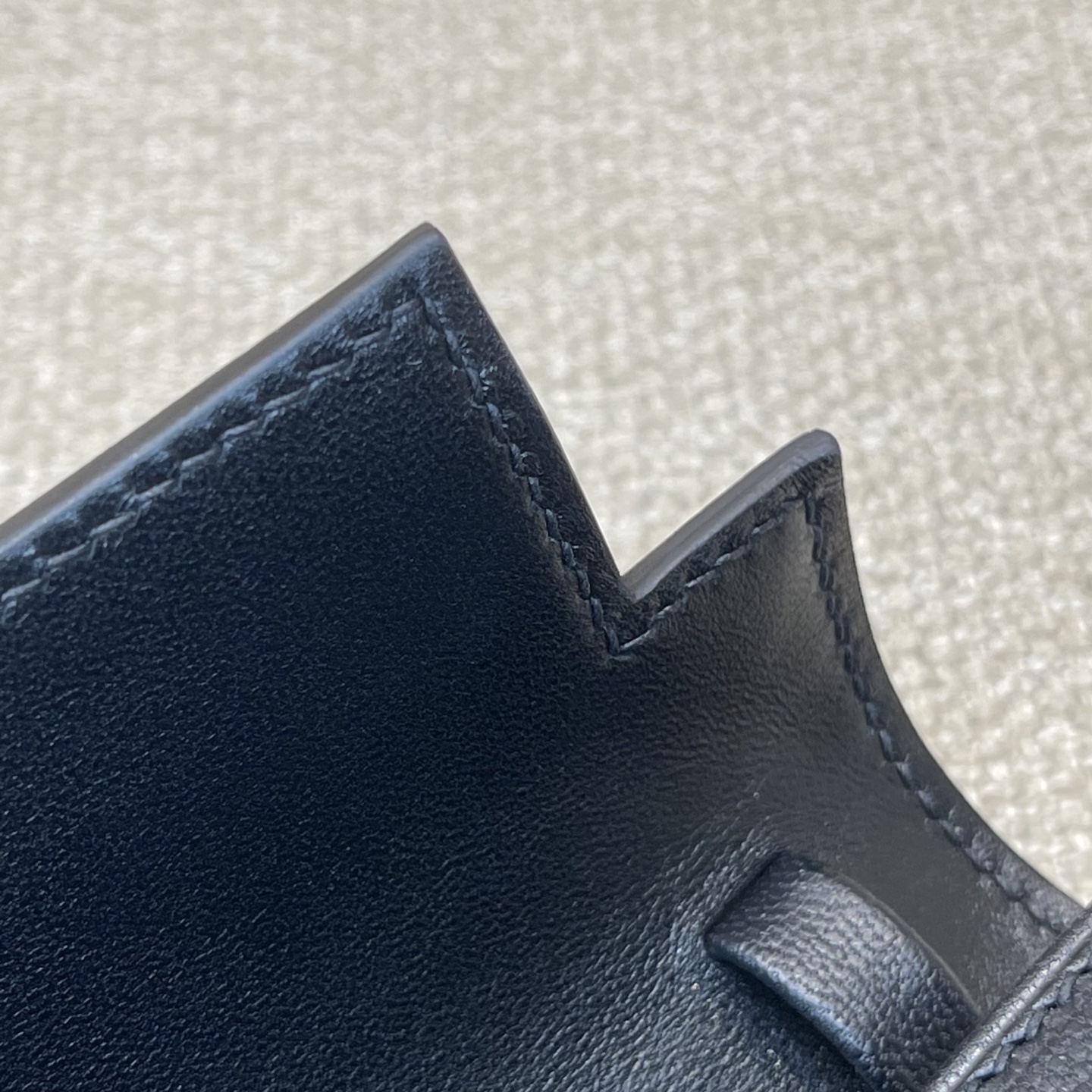 Hermès Model: Kelly Elan Feather Color: Black with Silver Buckle Dimensions: 27.5cm x 15cm x 5cm