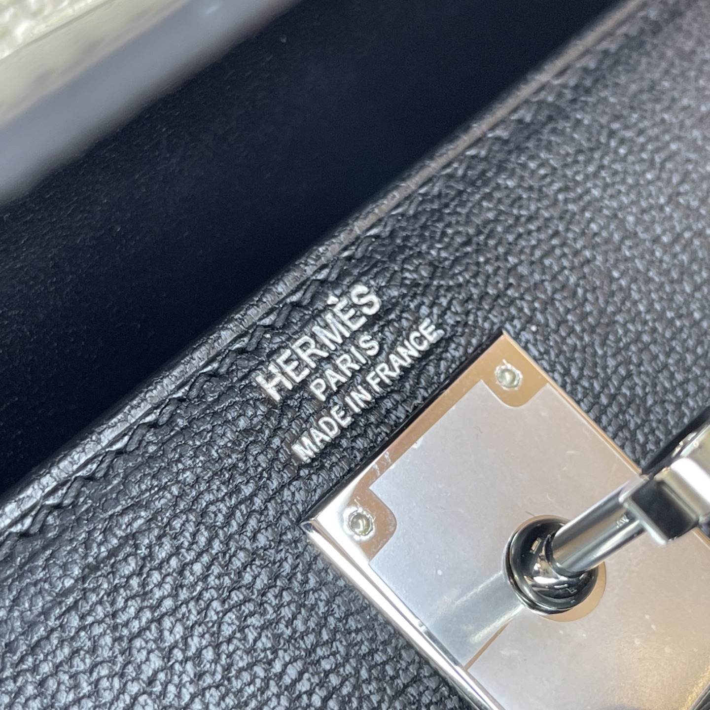 Hermès Model: Kelly Elan Feather Color: Black with Silver Buckle Dimensions: 27.5cm x 15cm x 5cm