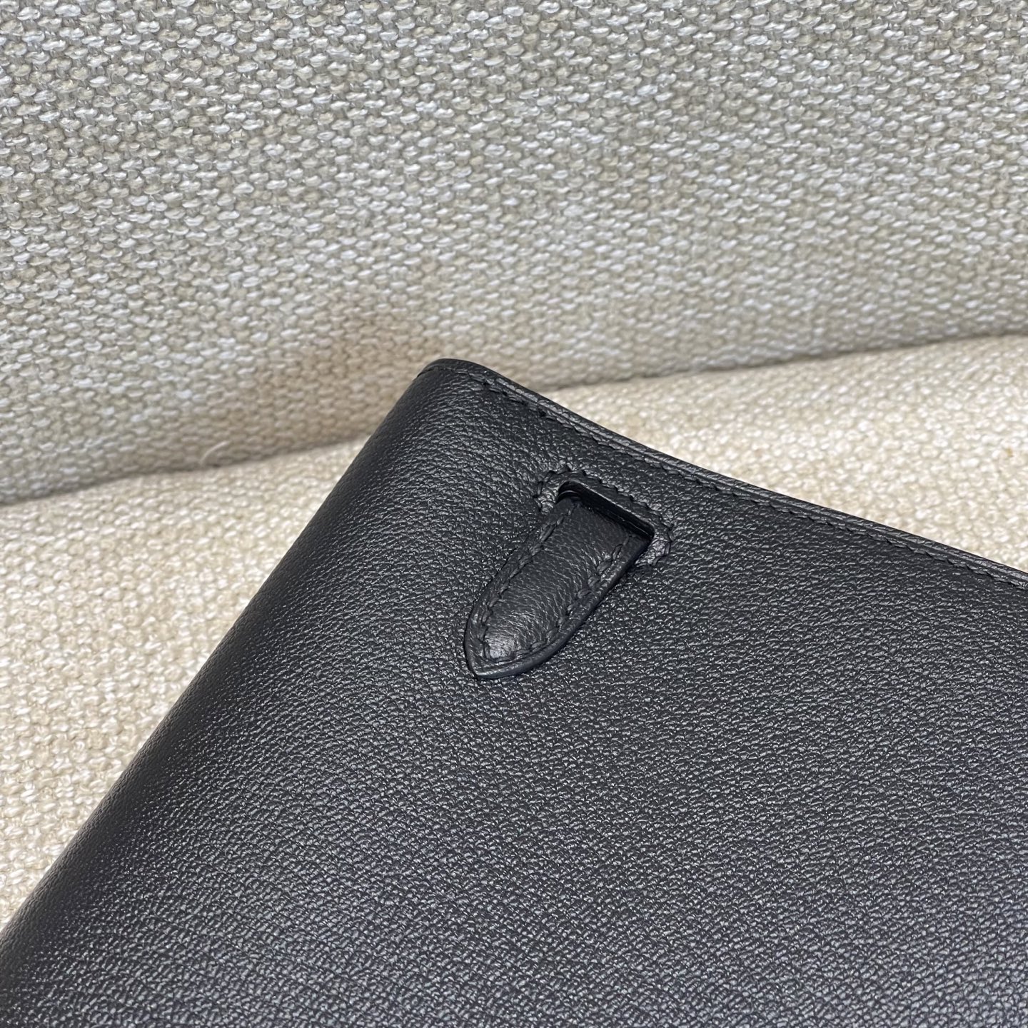 Hermès Model: Kelly Elan Feather Color: Black with Silver Buckle Dimensions: 27.5cm x 15cm x 5cm